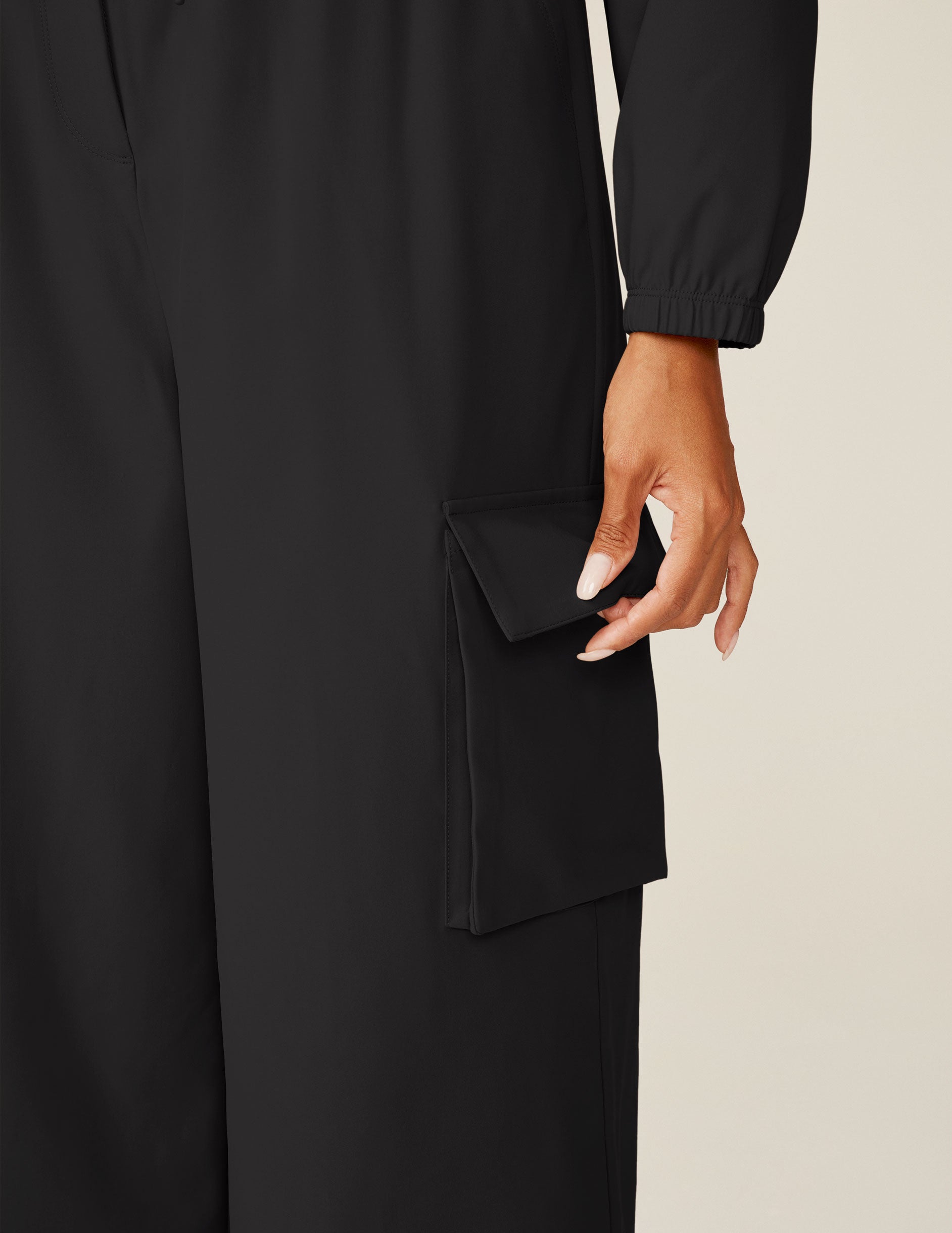 black cargo style long sleeve jumpsuit.