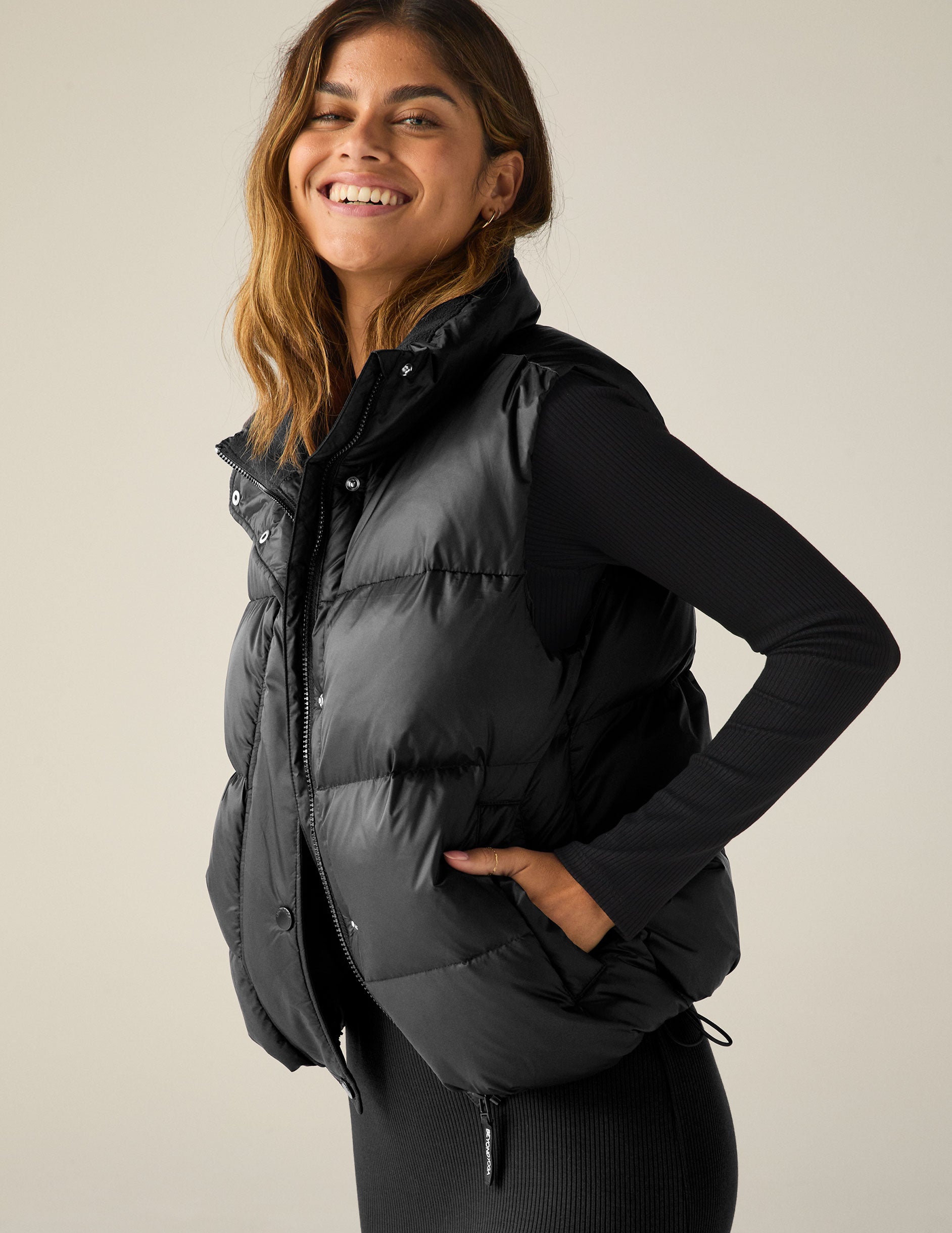 black button up puffer vest.