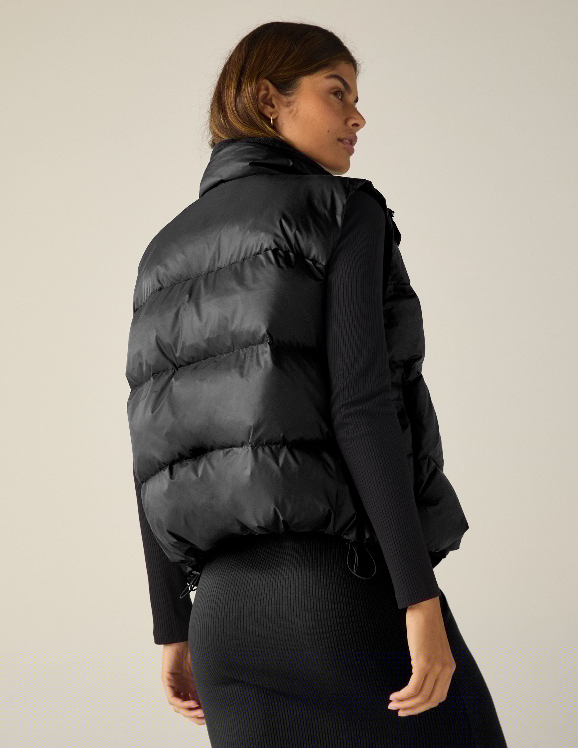 black button up puffer vest.