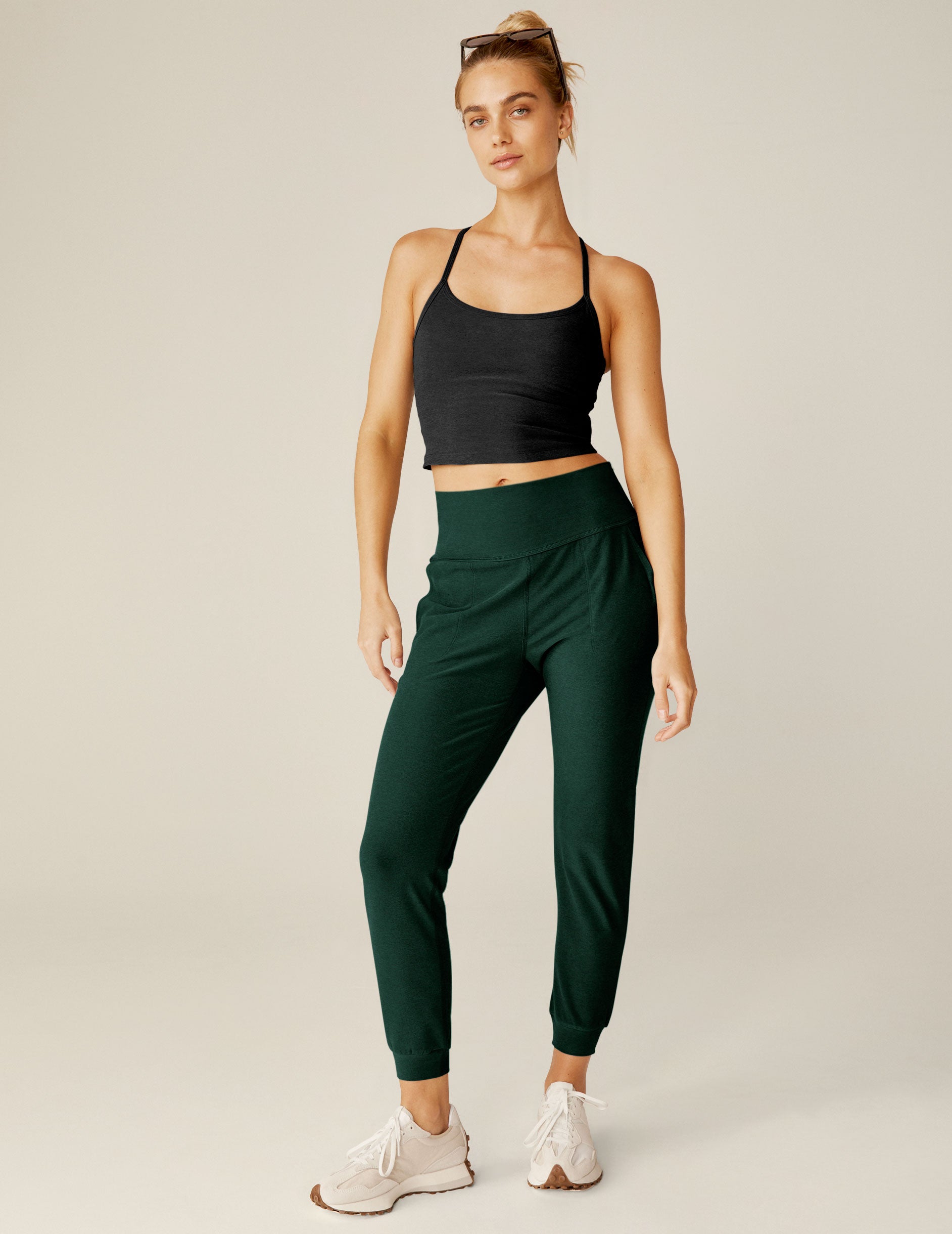 green high-waisted jogger pants.