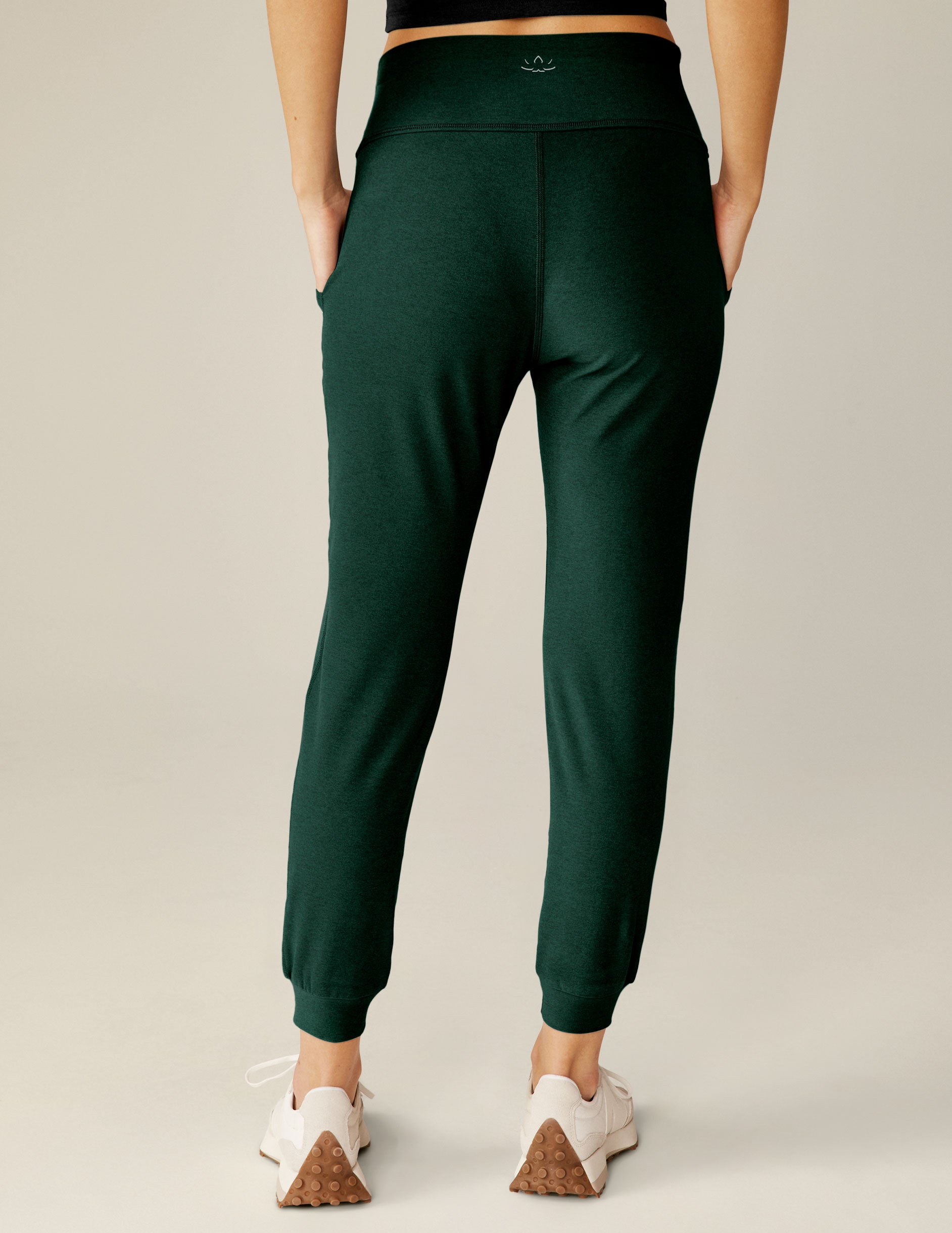 green high-waisted jogger pants.