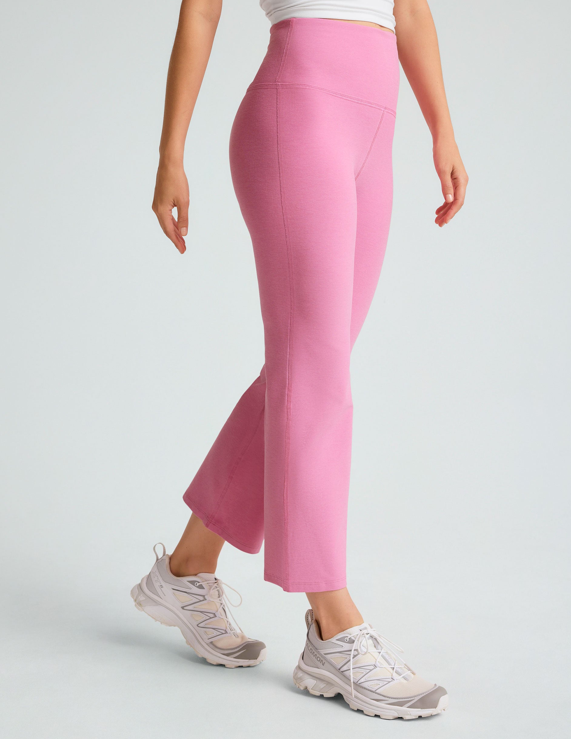 model is wearing pink high-waisted high-rise pants.