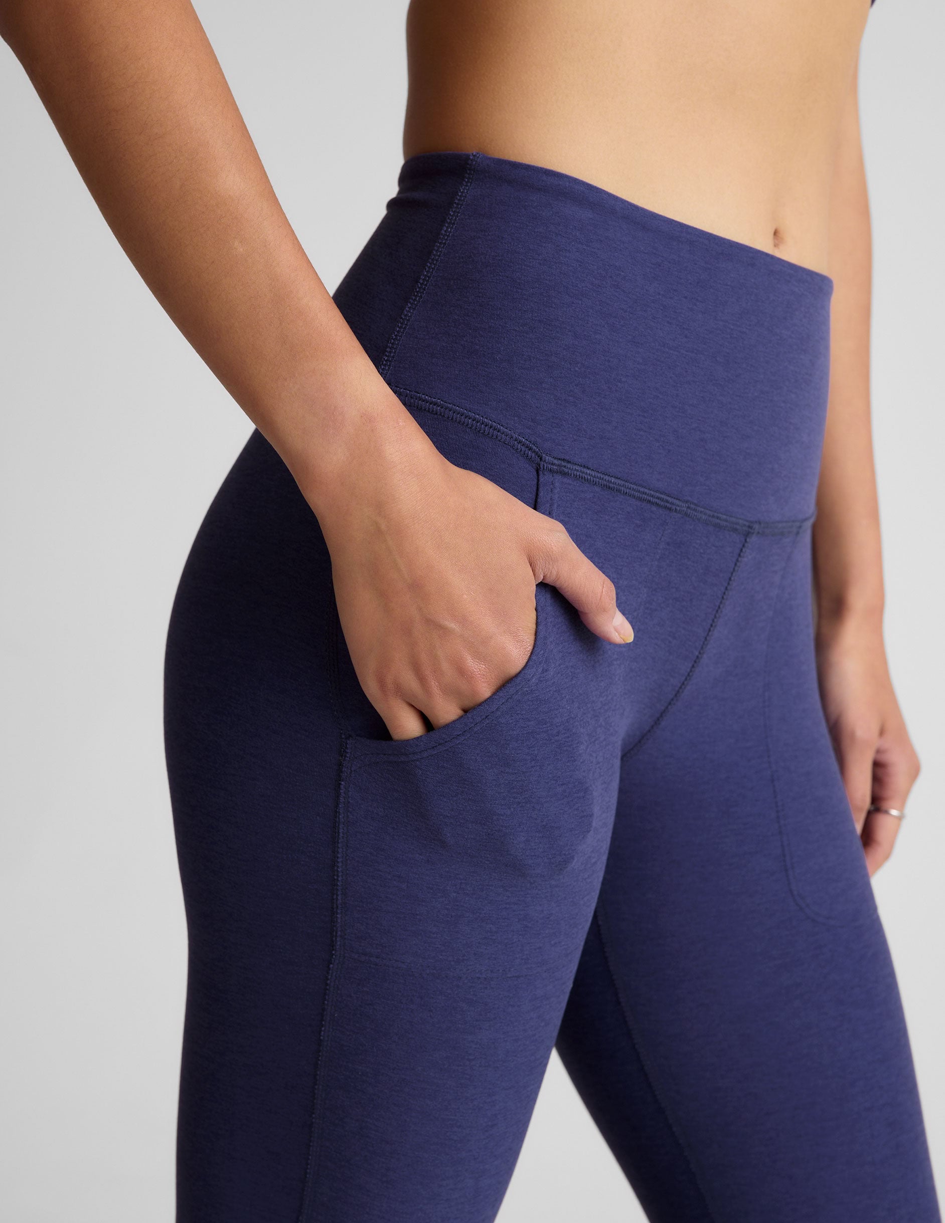 blue high-waisted bootcut pant with pockets.