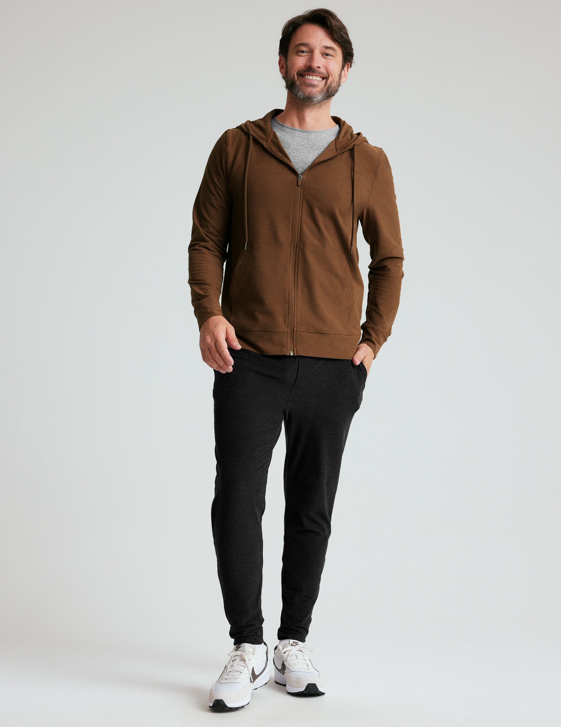 brown men's zip-up jacket with a hood and pockets.