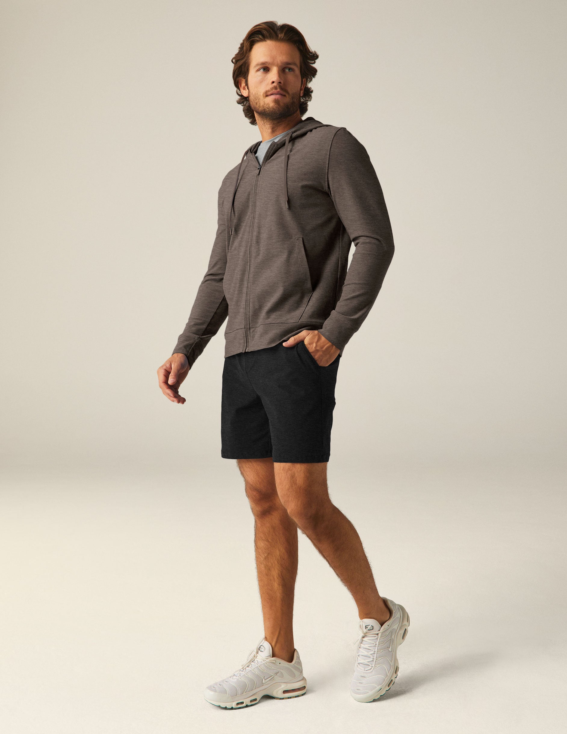 brown men's zip-up jacket with a hood and pockets.