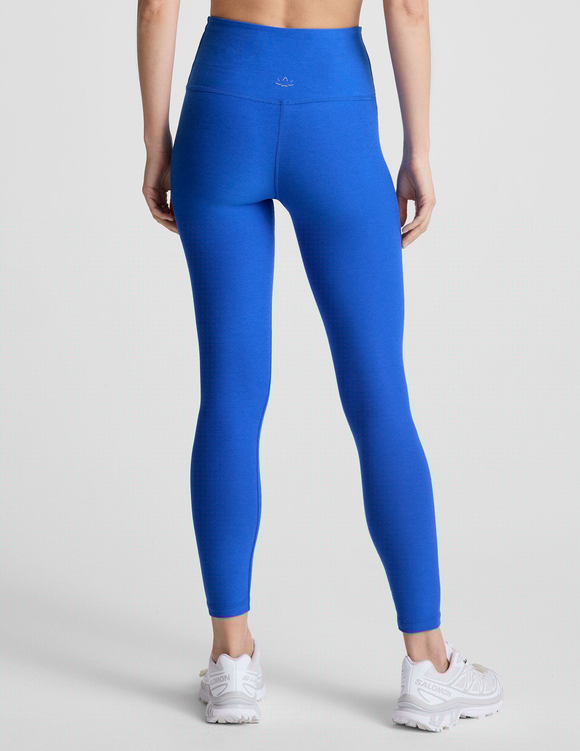 blue high-waisted midi length leggings with a 24" inseam and 5" rise waistband.