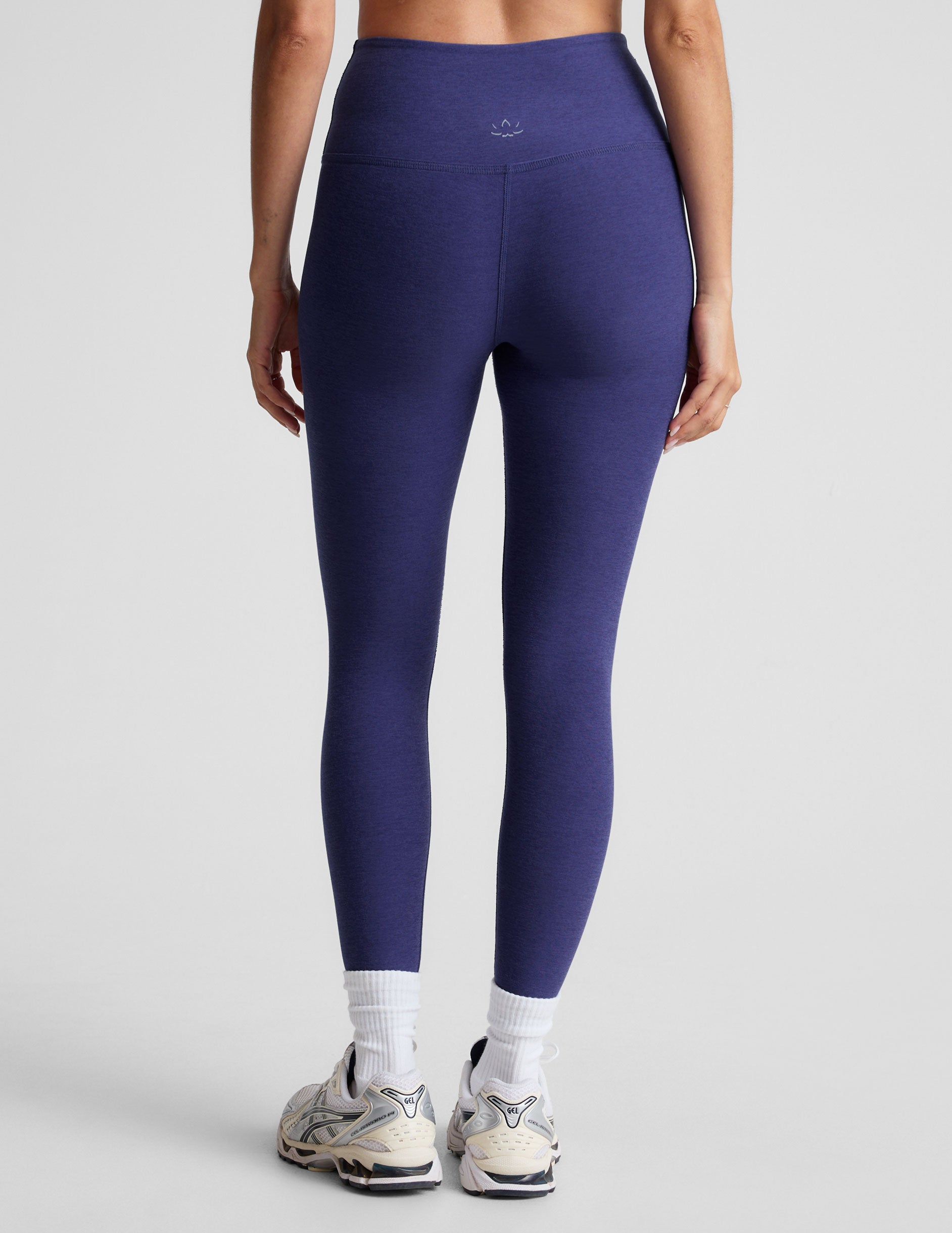 blue high-waisted midi length leggings.
