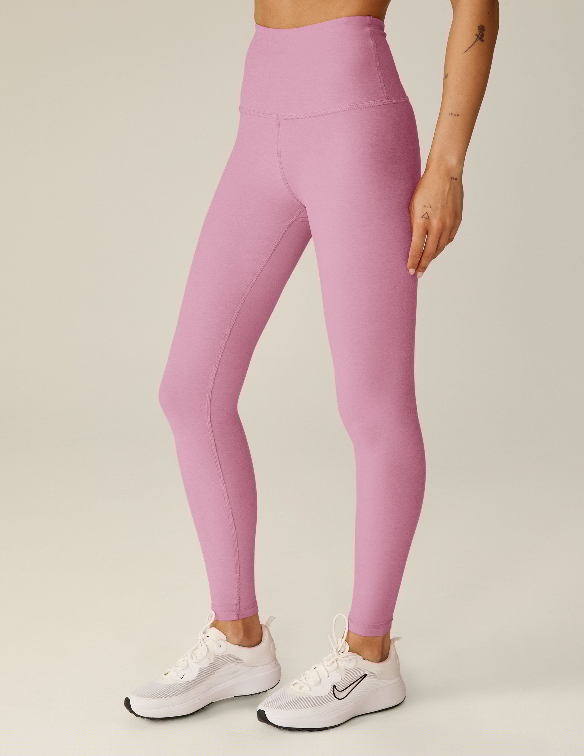 pink high-waisted midi leggings.