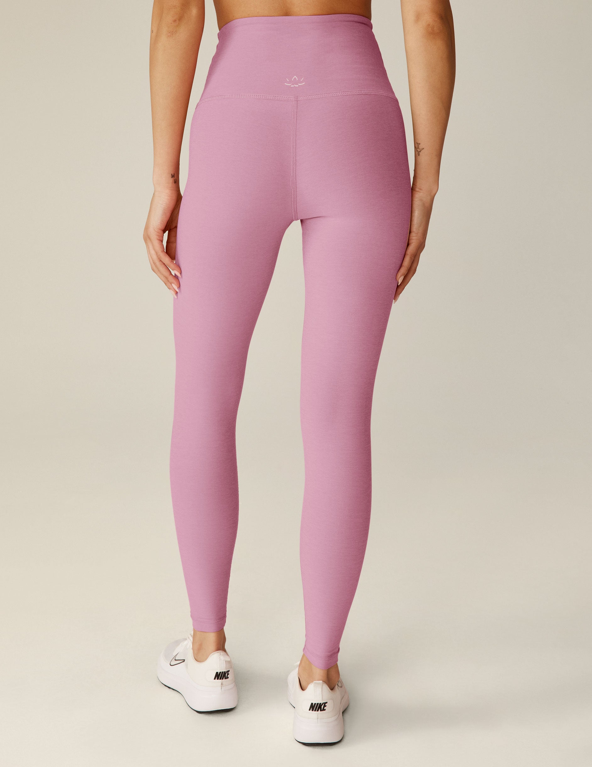 pink high-waisted midi leggings.
