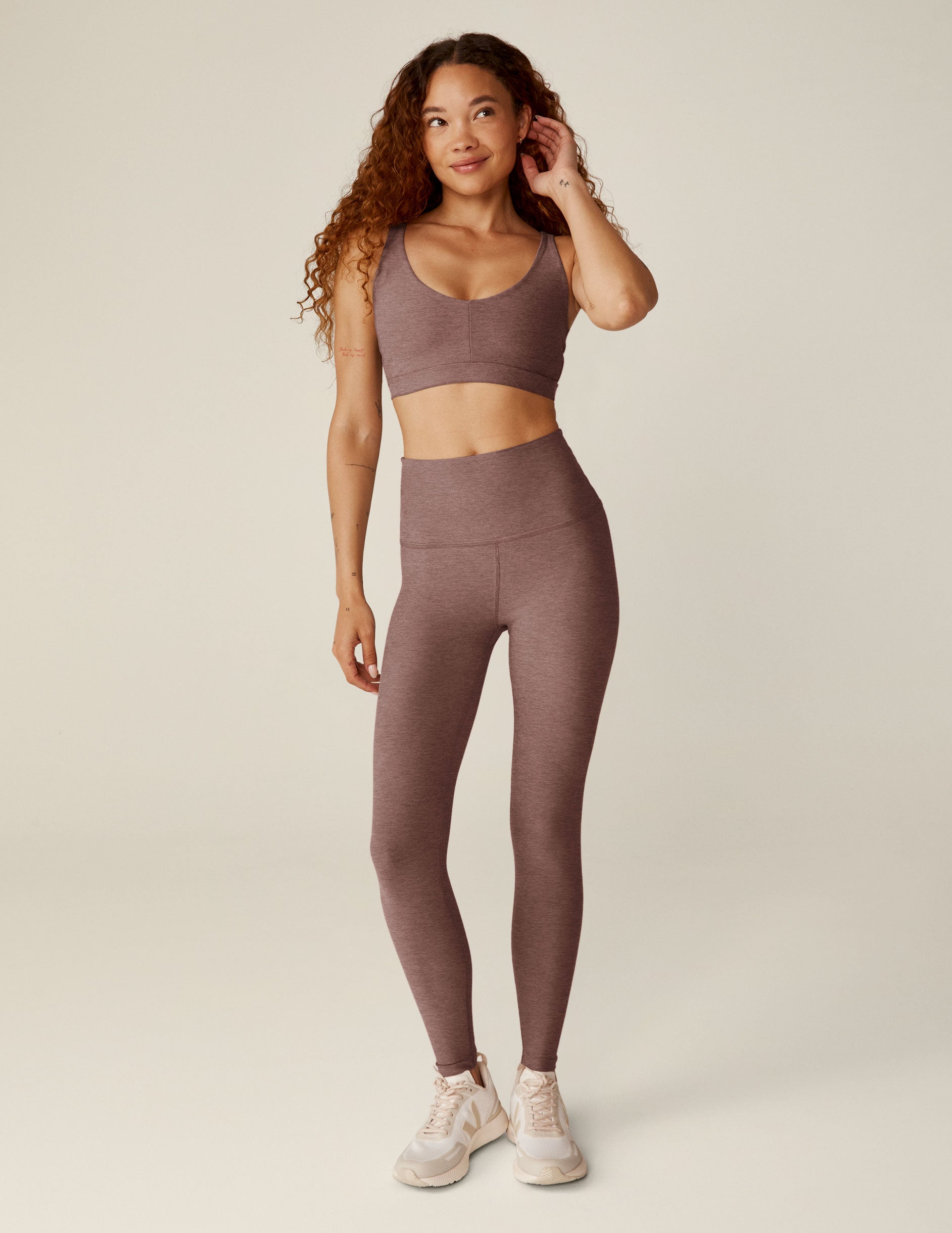 red high-waisted midi length leggings.
