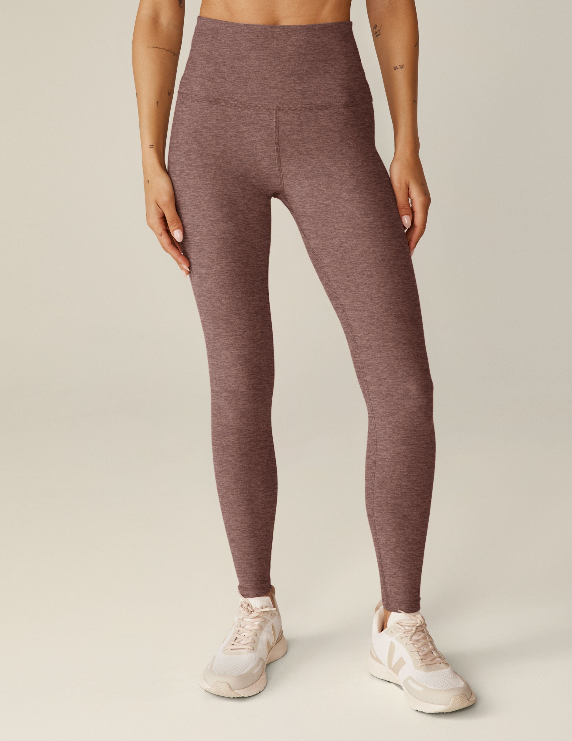 red high-waisted midi length leggings.