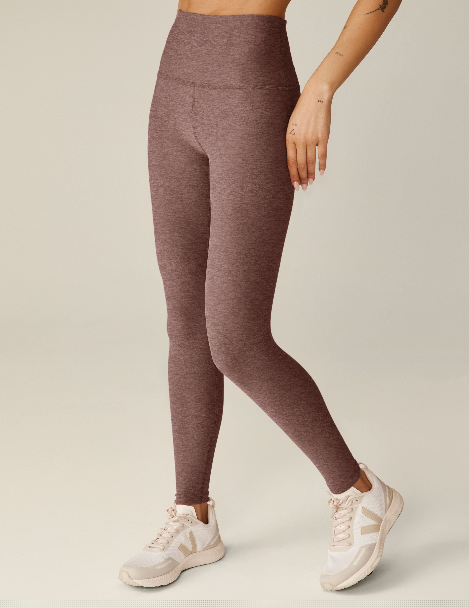 red high-waisted midi length leggings.