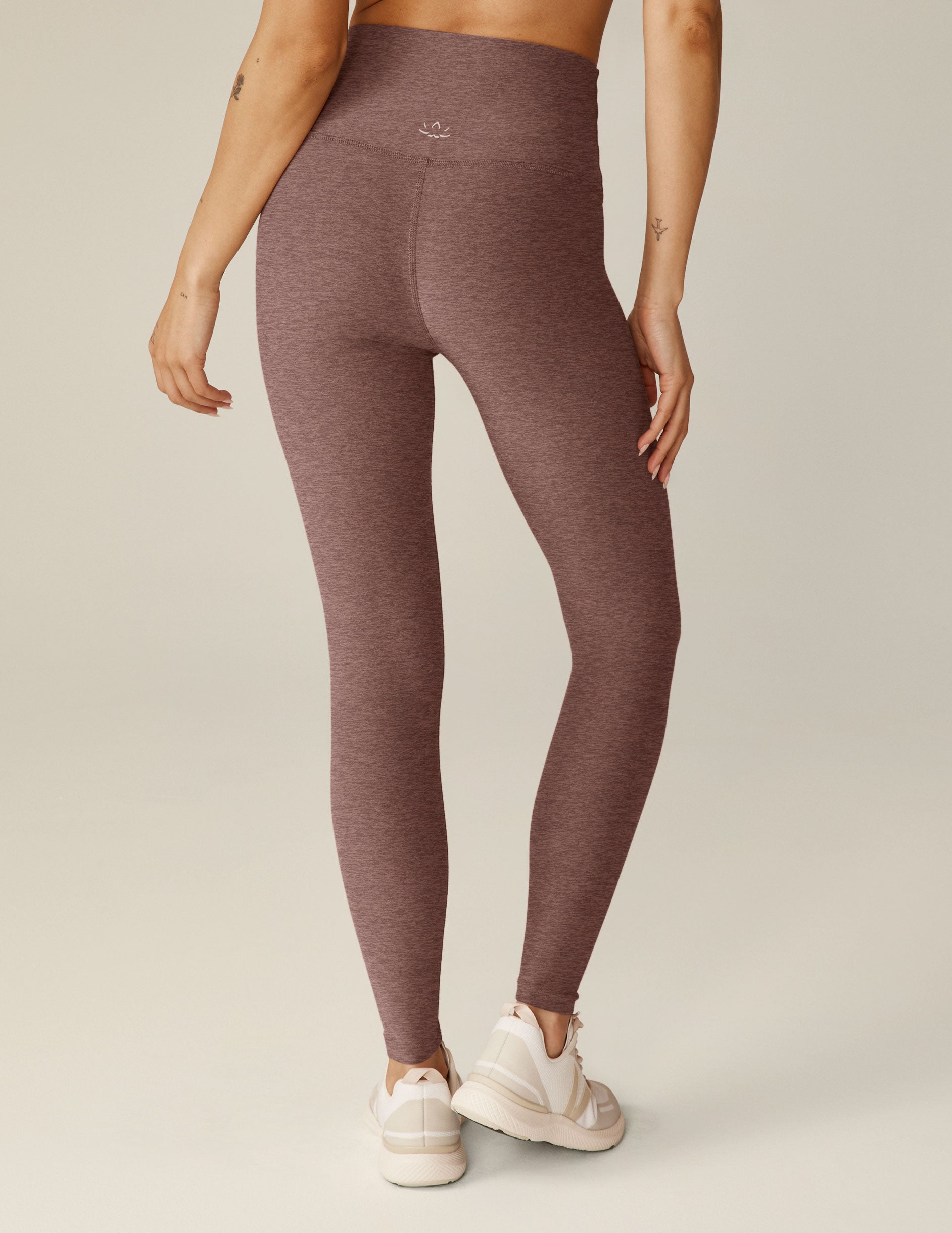 red high-waisted midi length leggings.