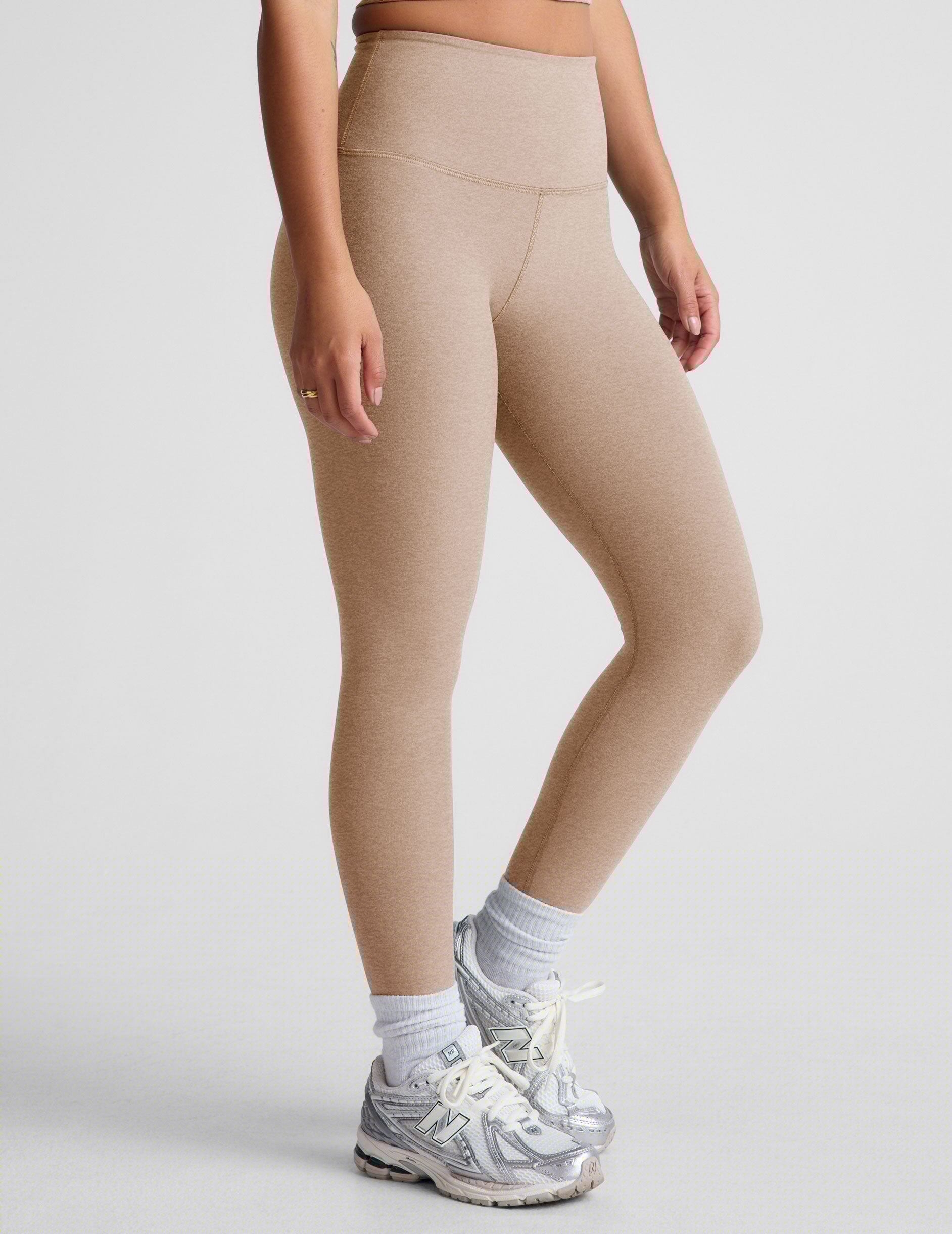 brown high-waisted midi length leggings.
