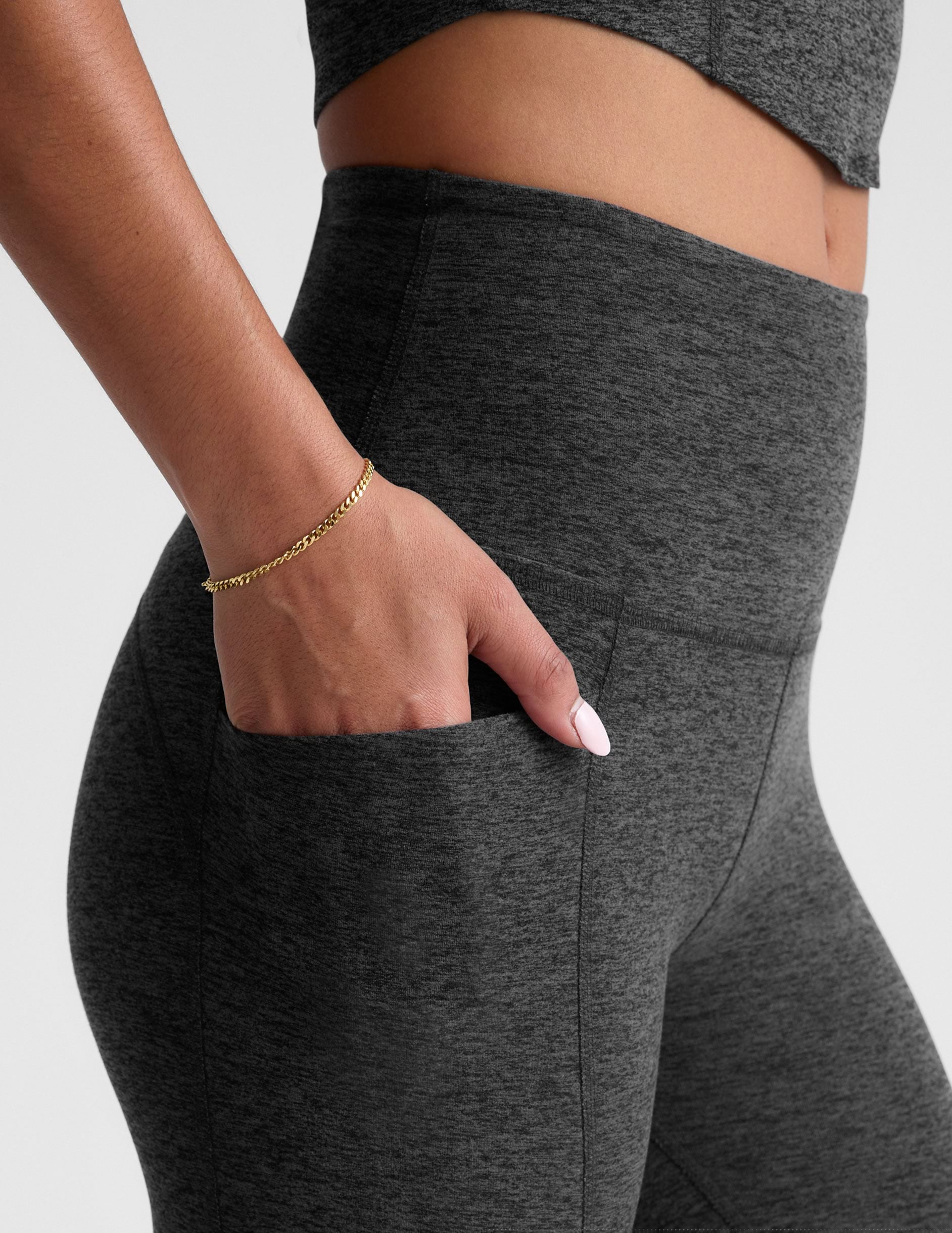 black-charcoal high-waisted midi leggings with side pockets.