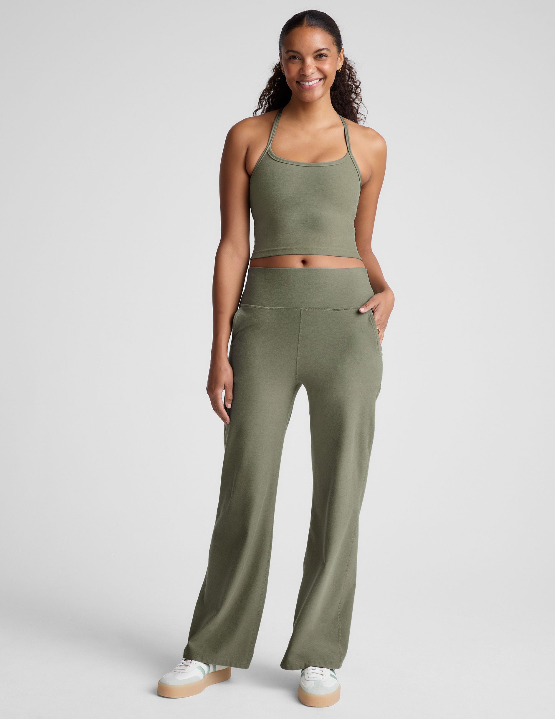 green racerback cropped tank top with thin straps.