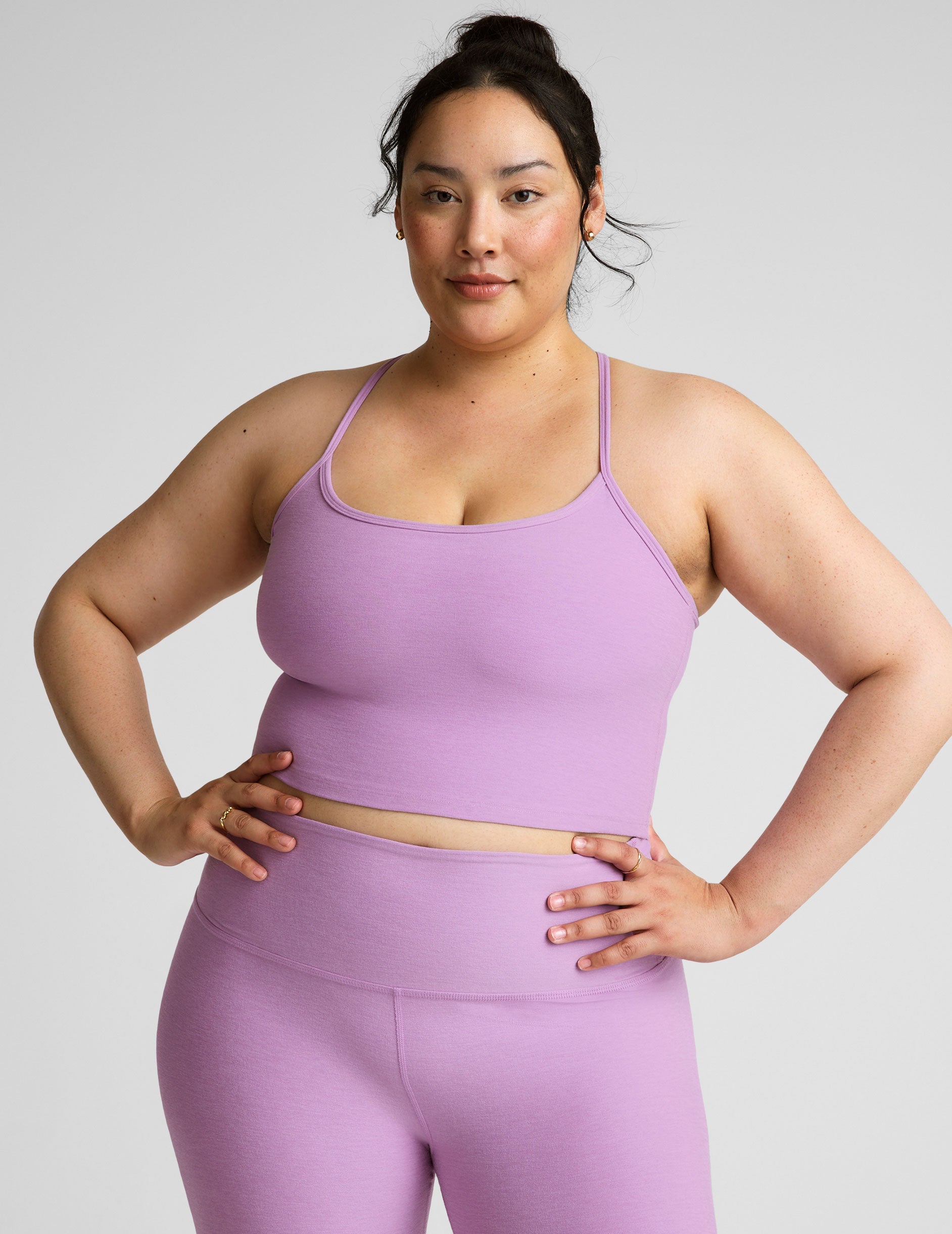 purple racerback cropped tank with spaghetti straps.