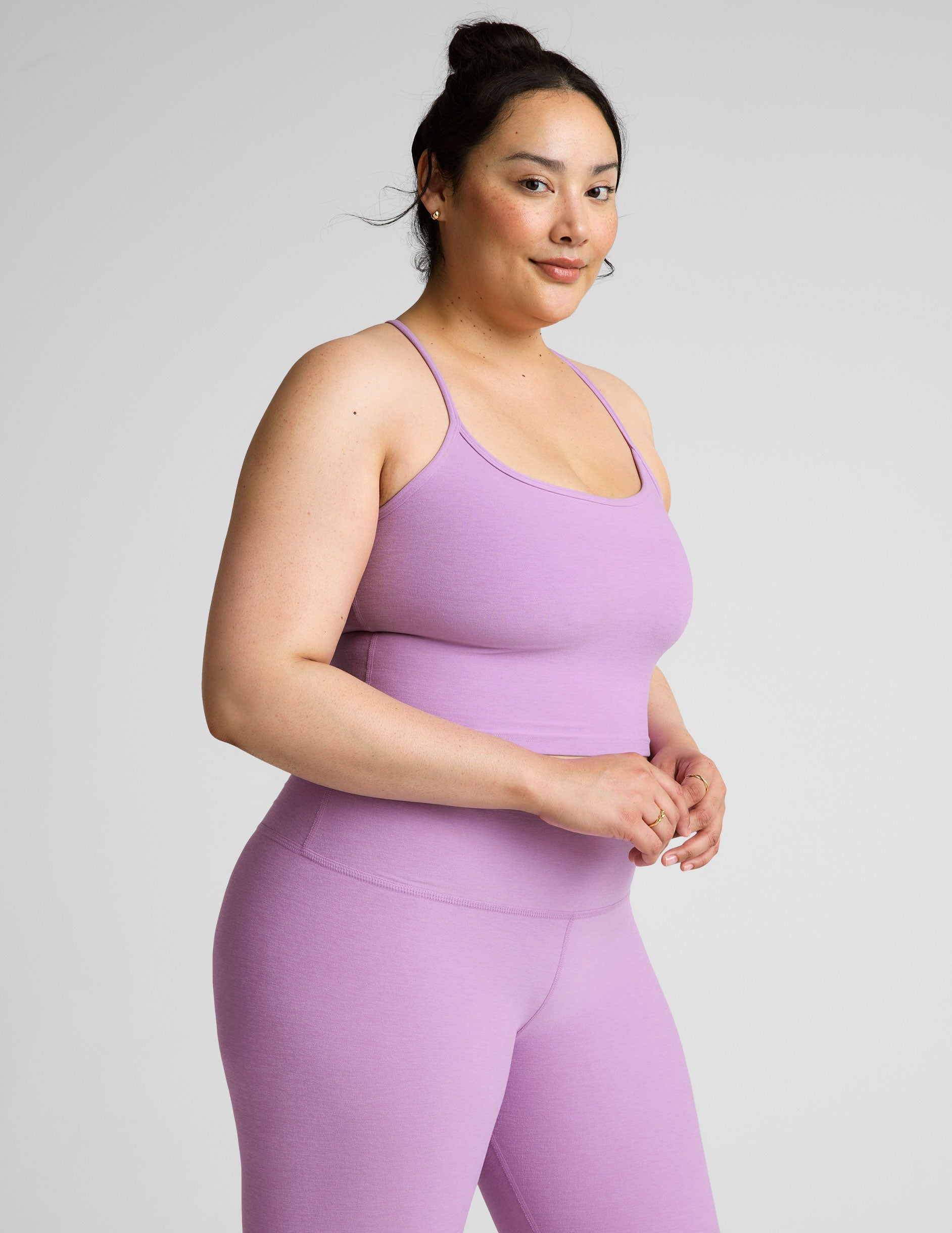 purple racerback cropped tank with spaghetti straps.