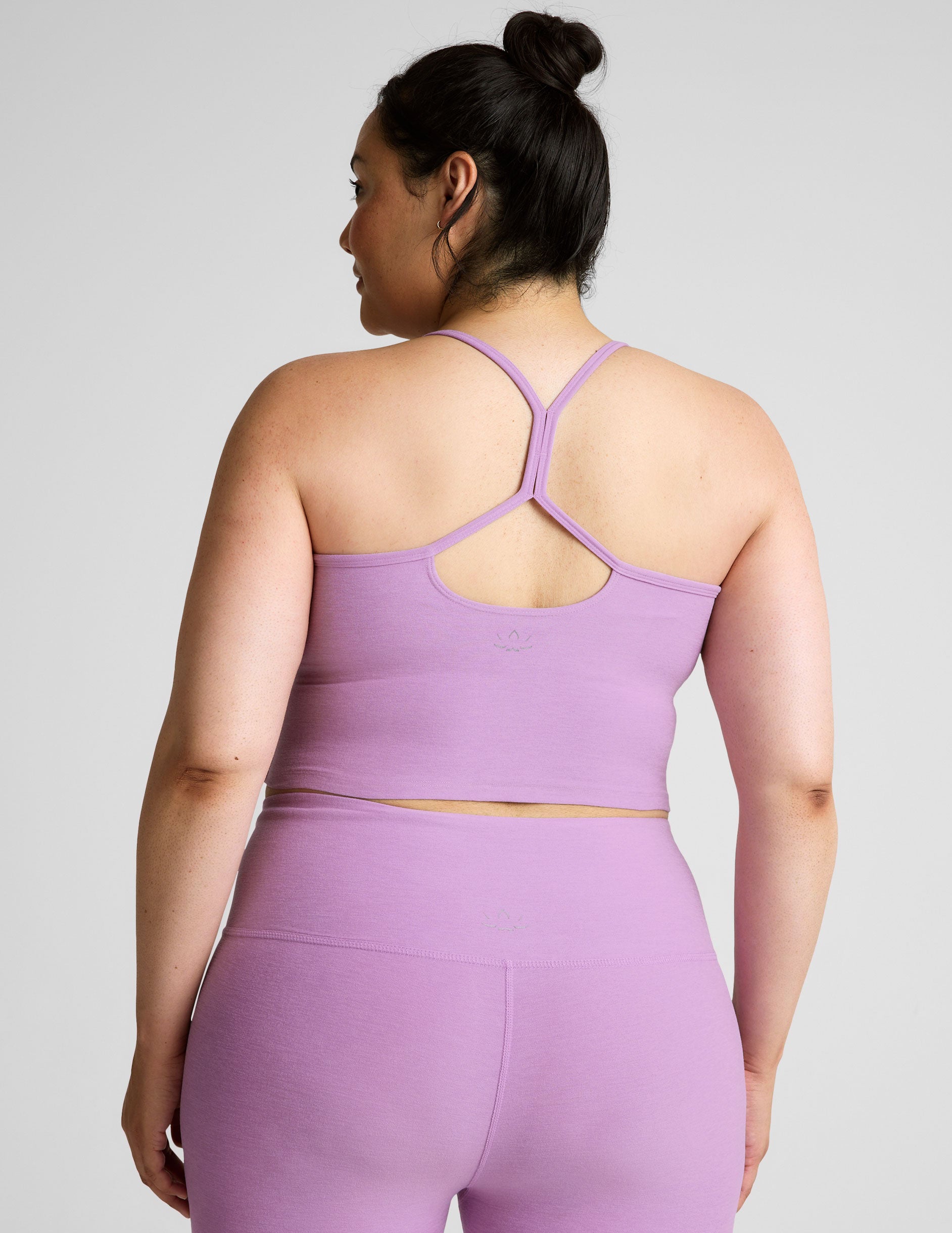 purple racerback cropped tank with spaghetti straps.