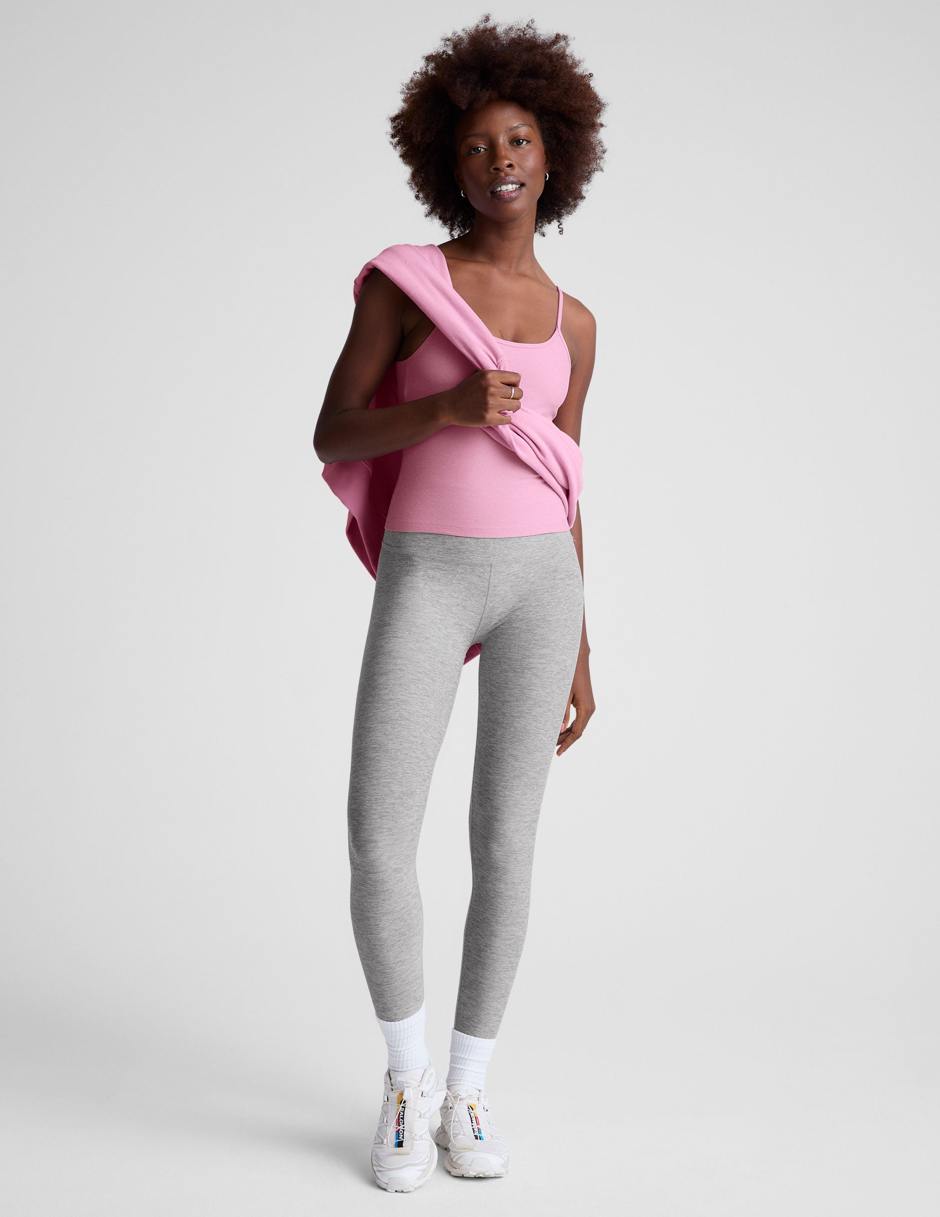 pink waist length tank with adjustable spaghetti straps.