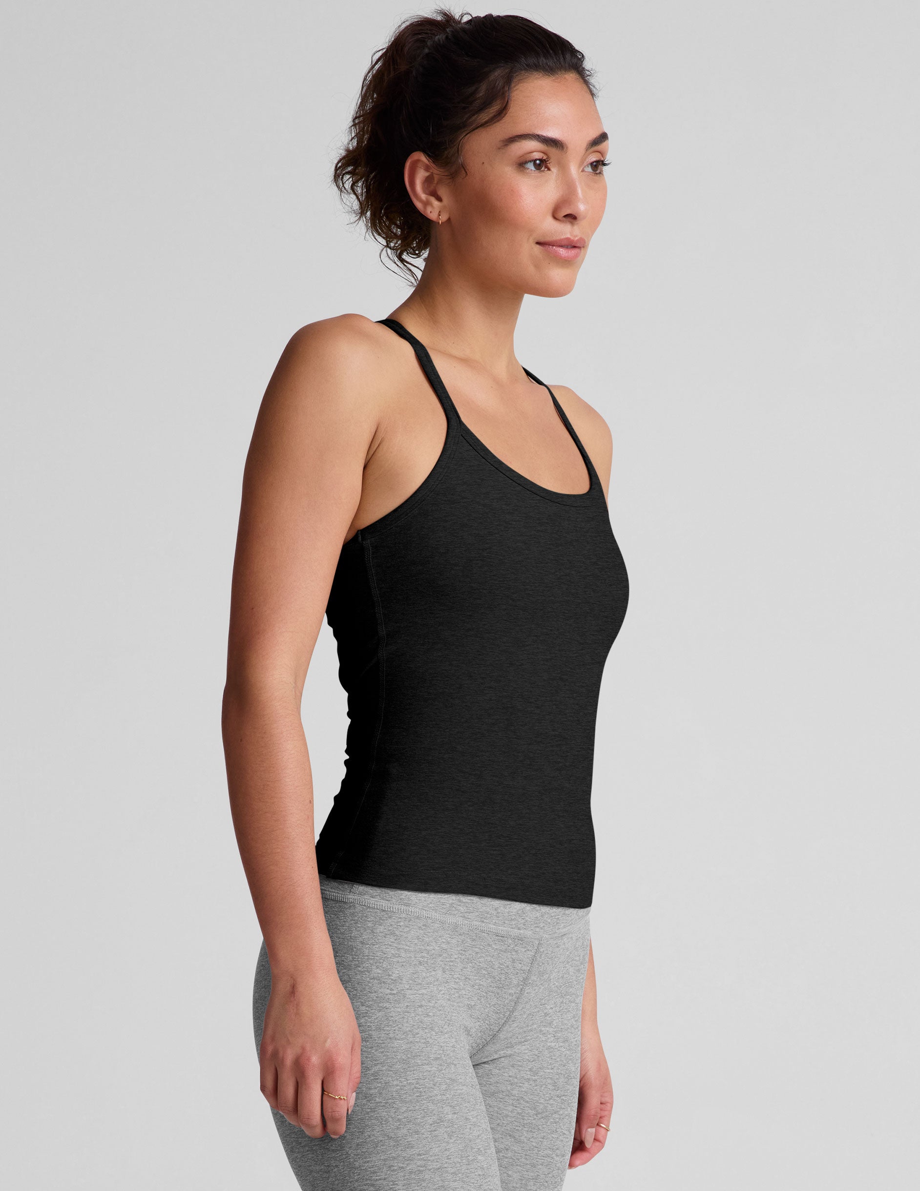 black midway length tank with adjustable spaghetti straps.