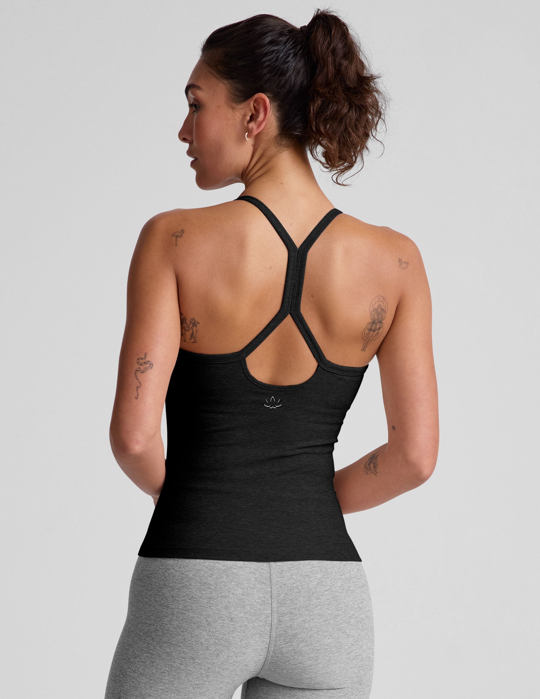 black midway length tank with adjustable spaghetti straps.