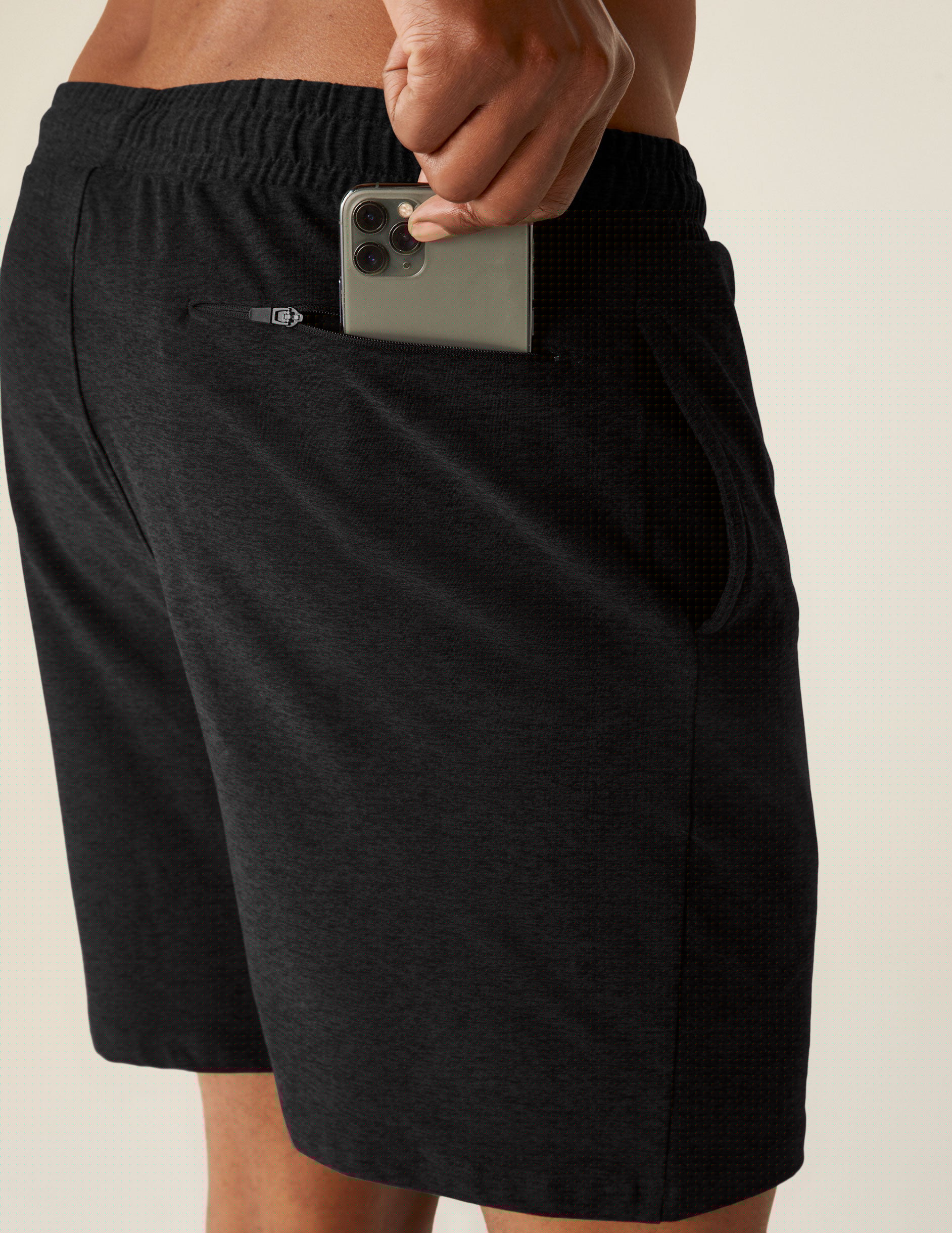 black relaxed fit men's athleisure shorts with pockets.