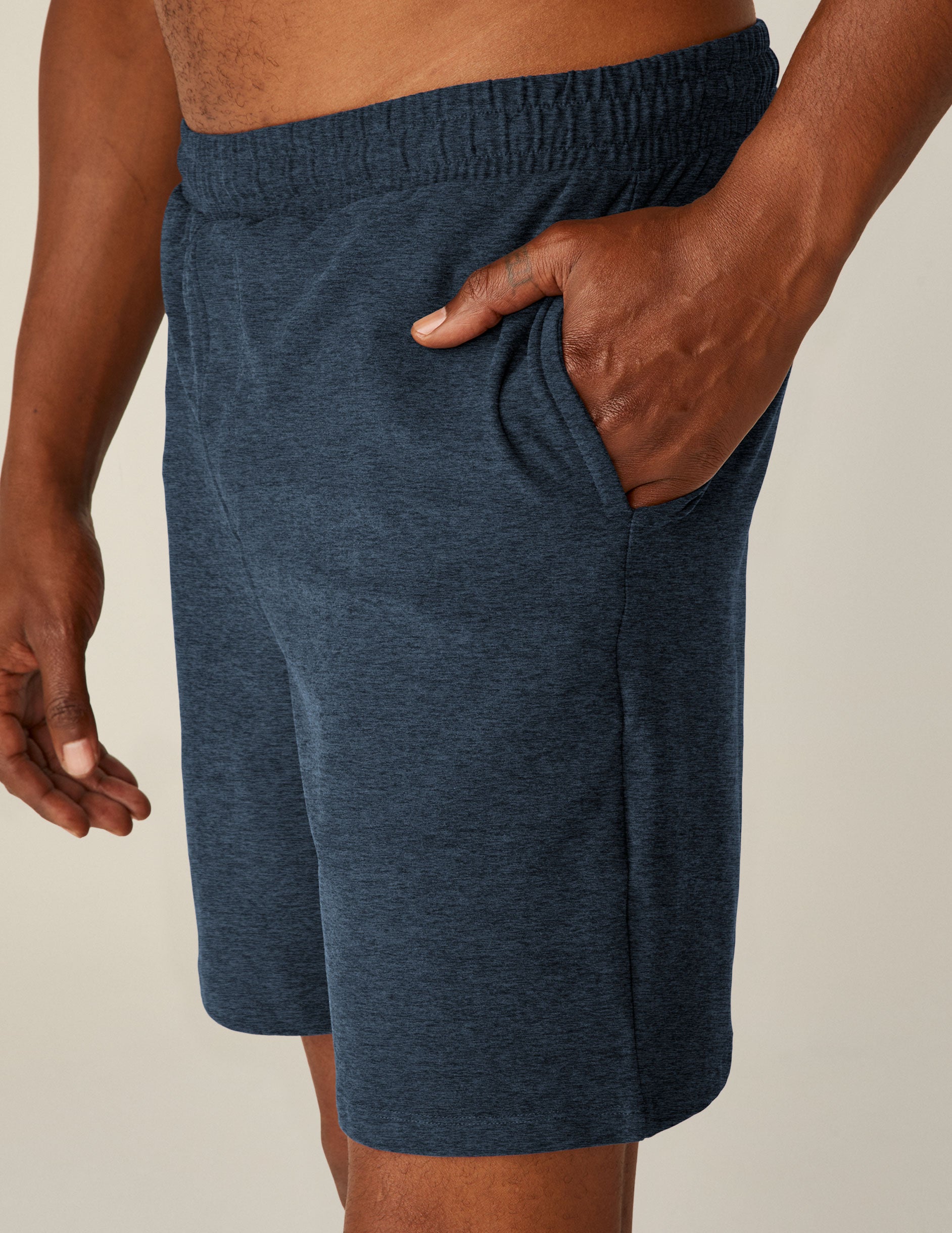 blue relaxed fit men's athleisure shorts with pockets.