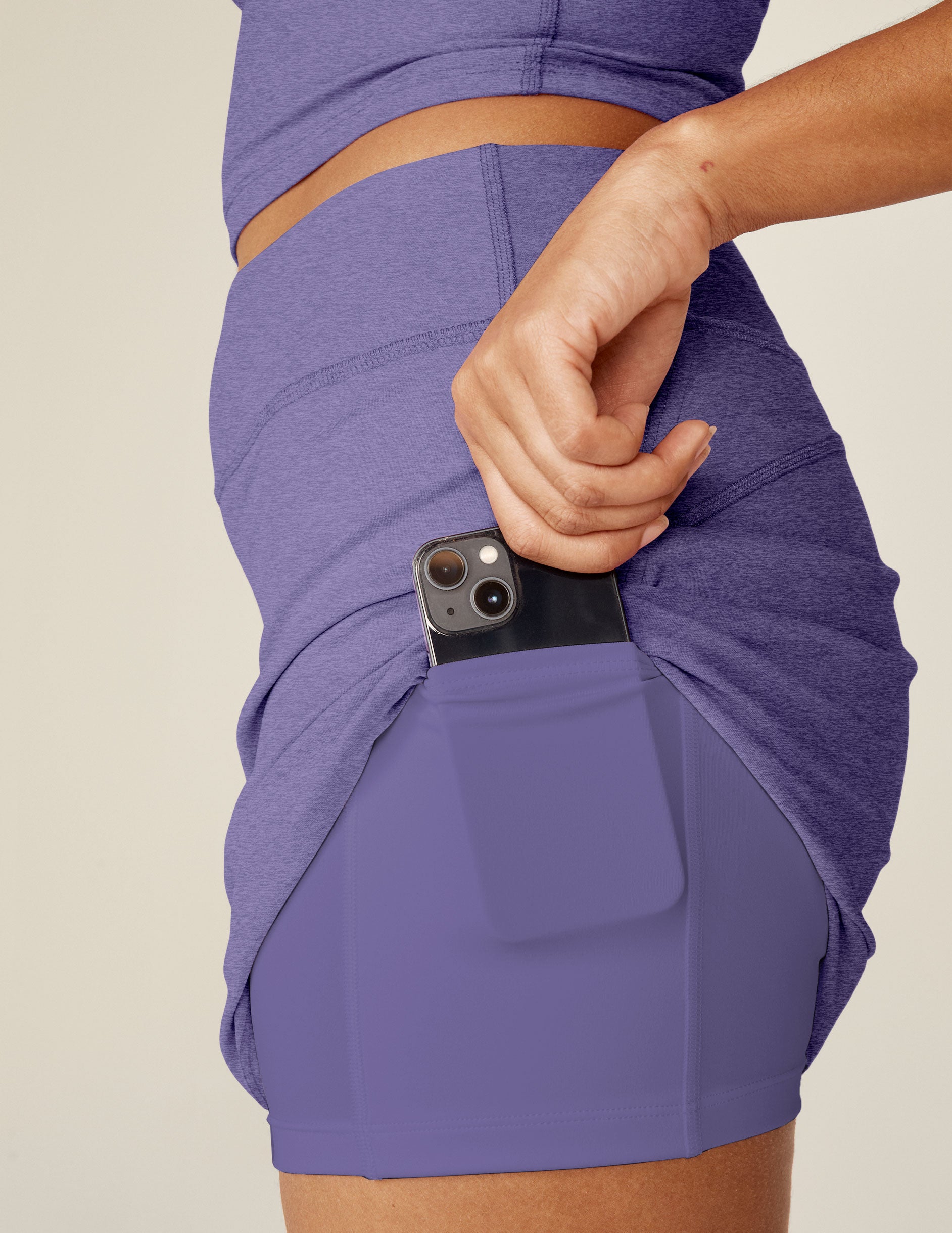 purple mini skirt with built-in shorts with pockets.