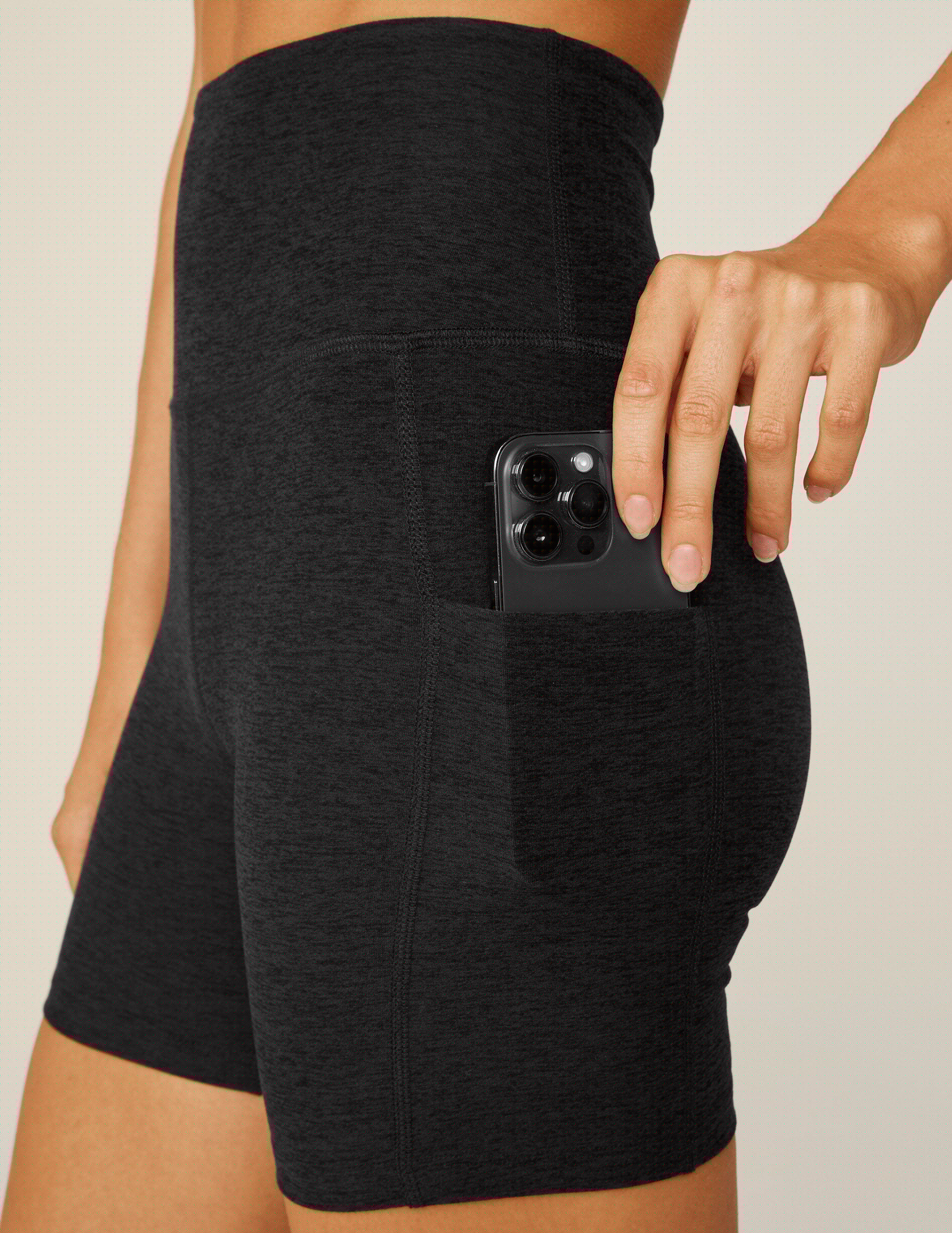 black high-waisted 5" biker shorts with pockets.