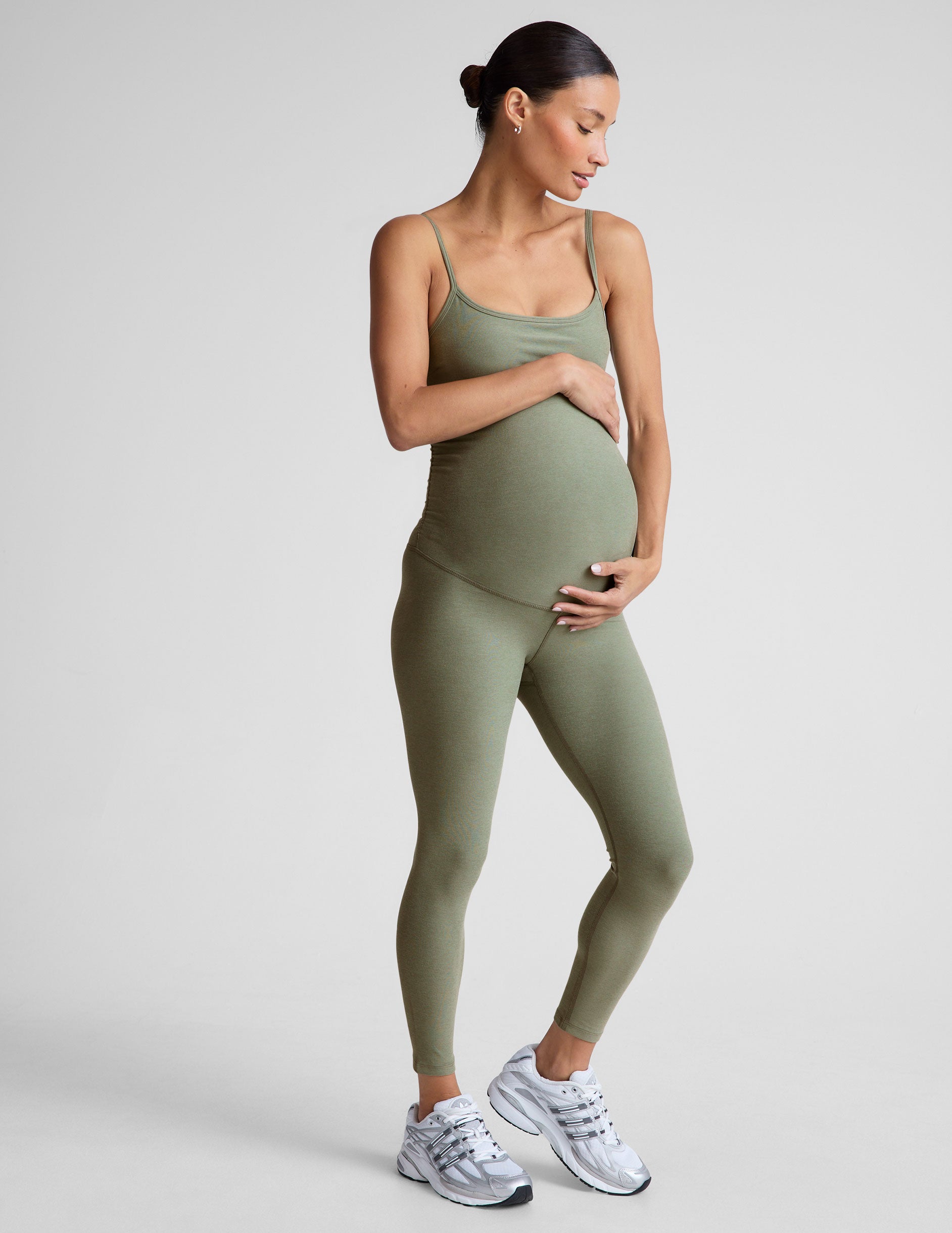 green one-piece maternity jumpsuit.