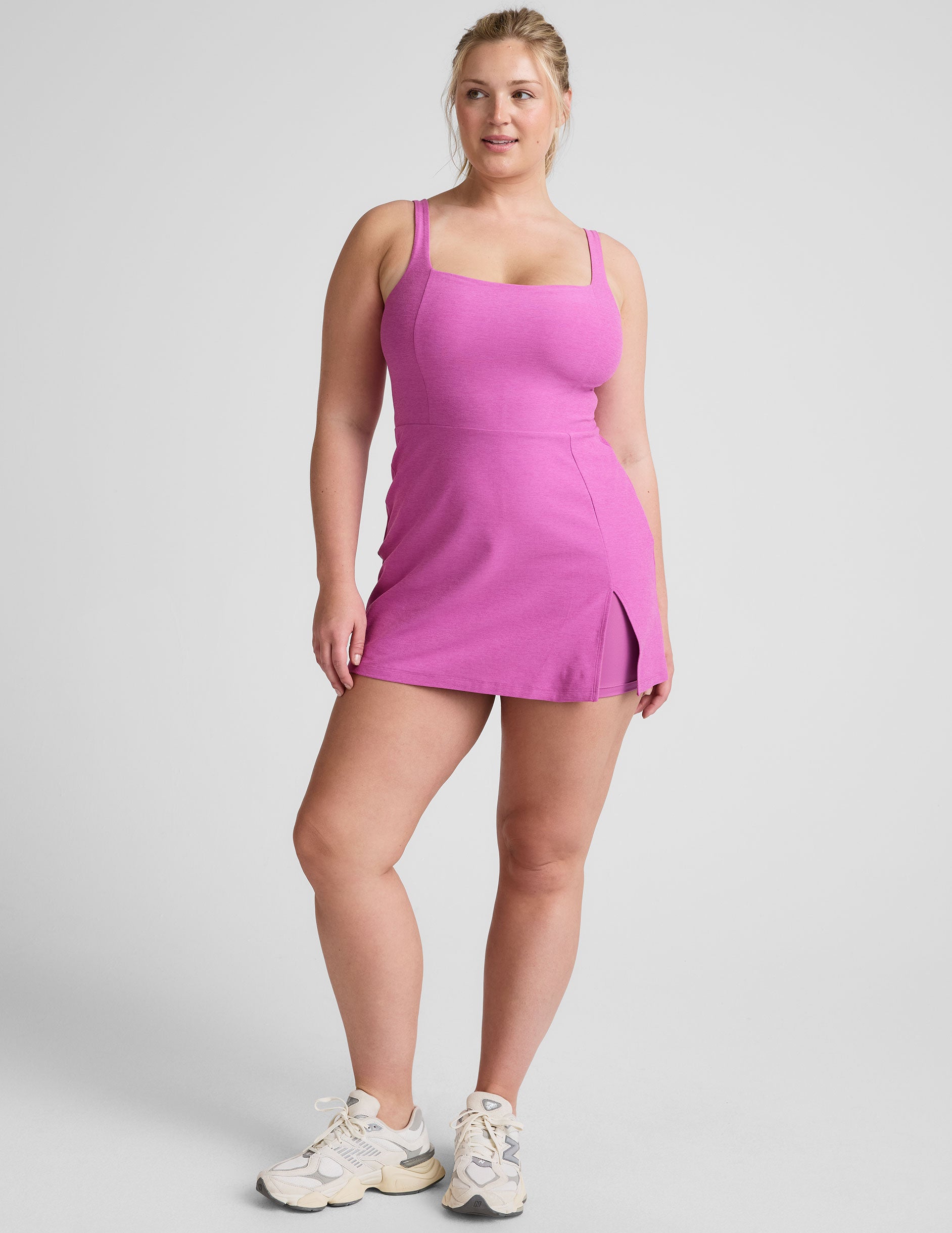 purple mini tank dress with a square neckline, side slit, and built-in shorts with pockets.