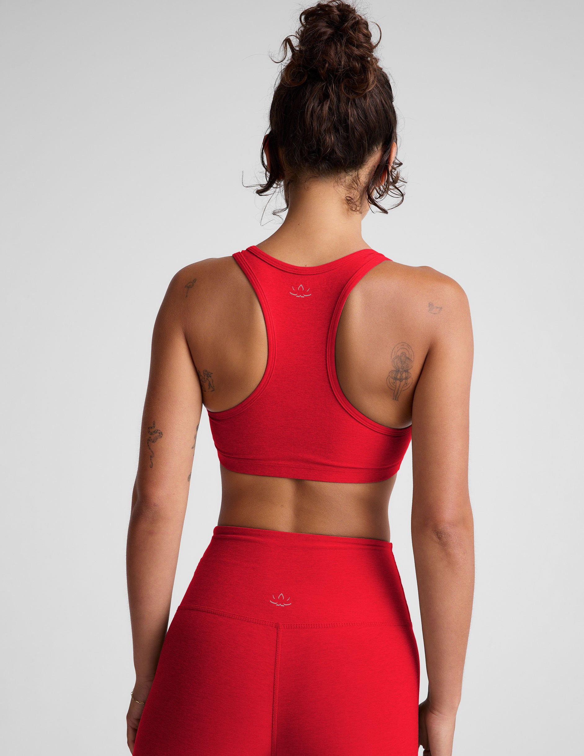 red self-lined bra with removable padding.