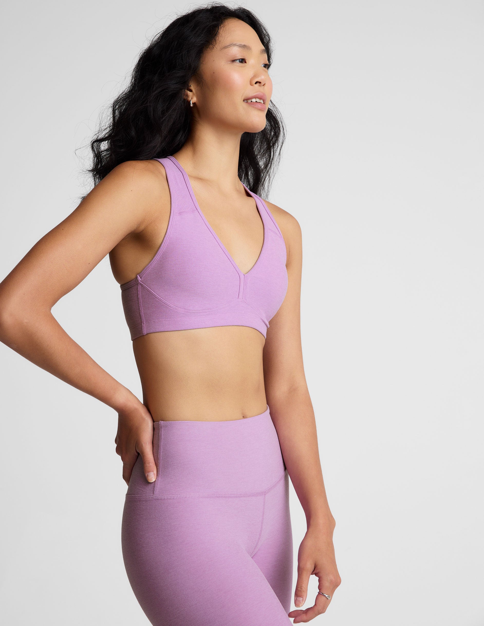purple bra top with body contoured seams and removable padding.