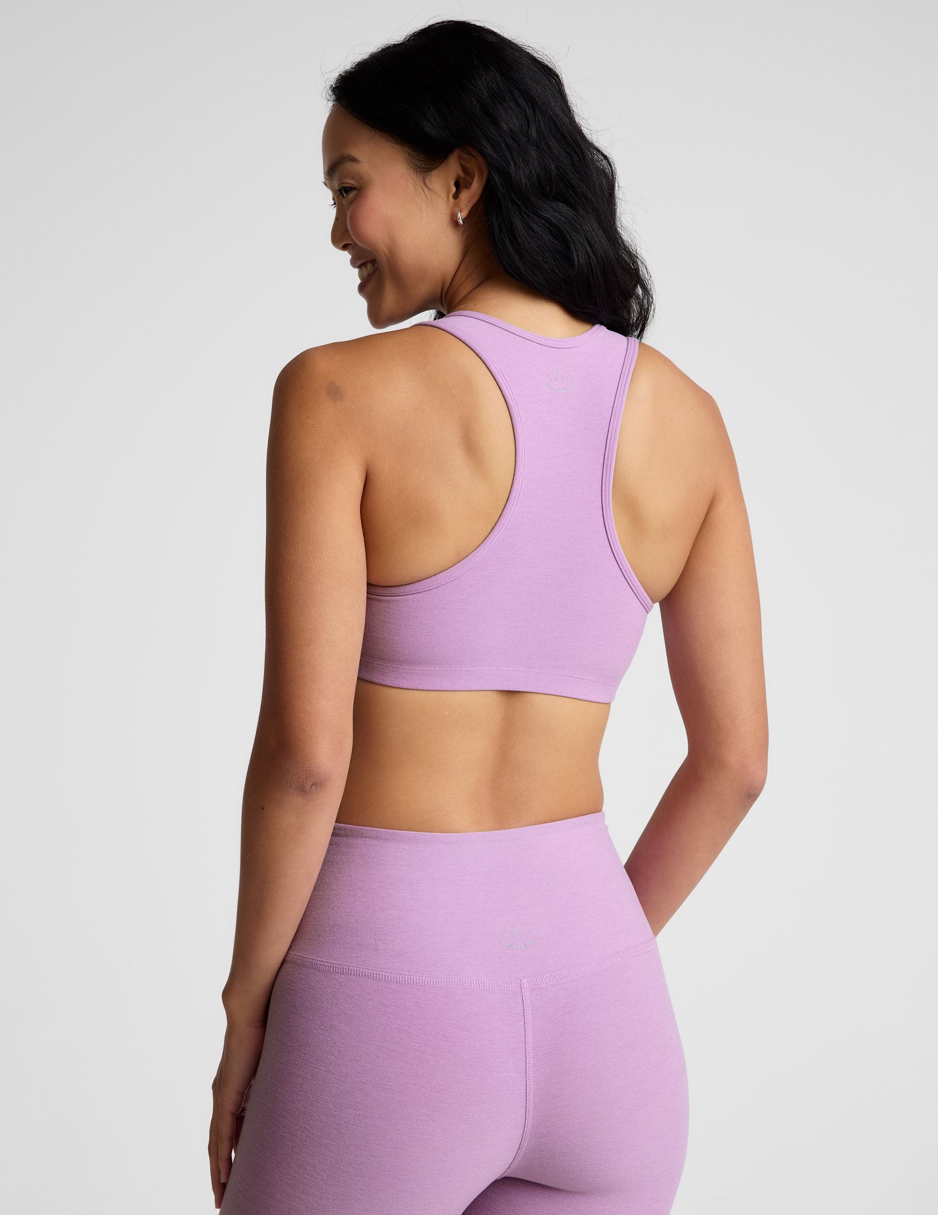 purple bra top with body contoured seams and removable padding.