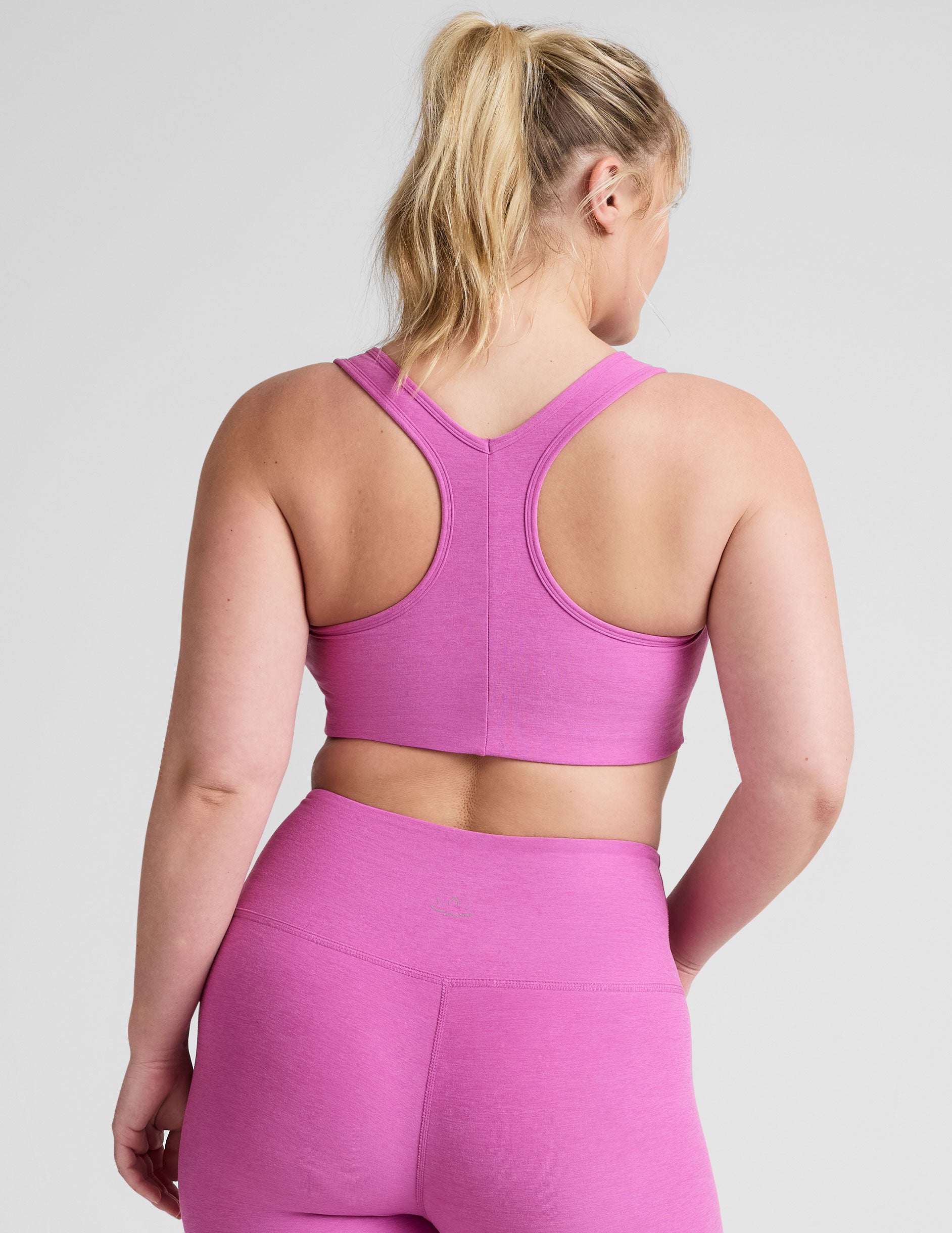 pink medium support racerback bra with a 2" hemband.