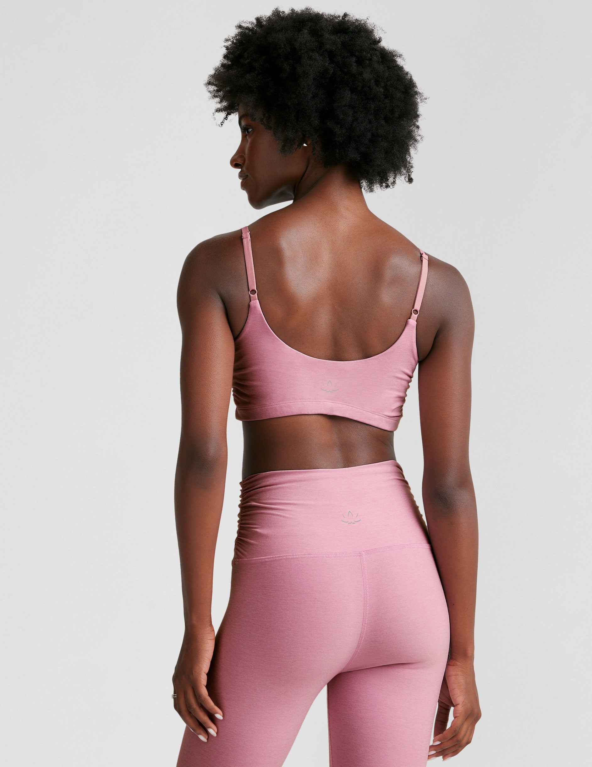 pink bra with adjustable straps and shirred detailing on the side.