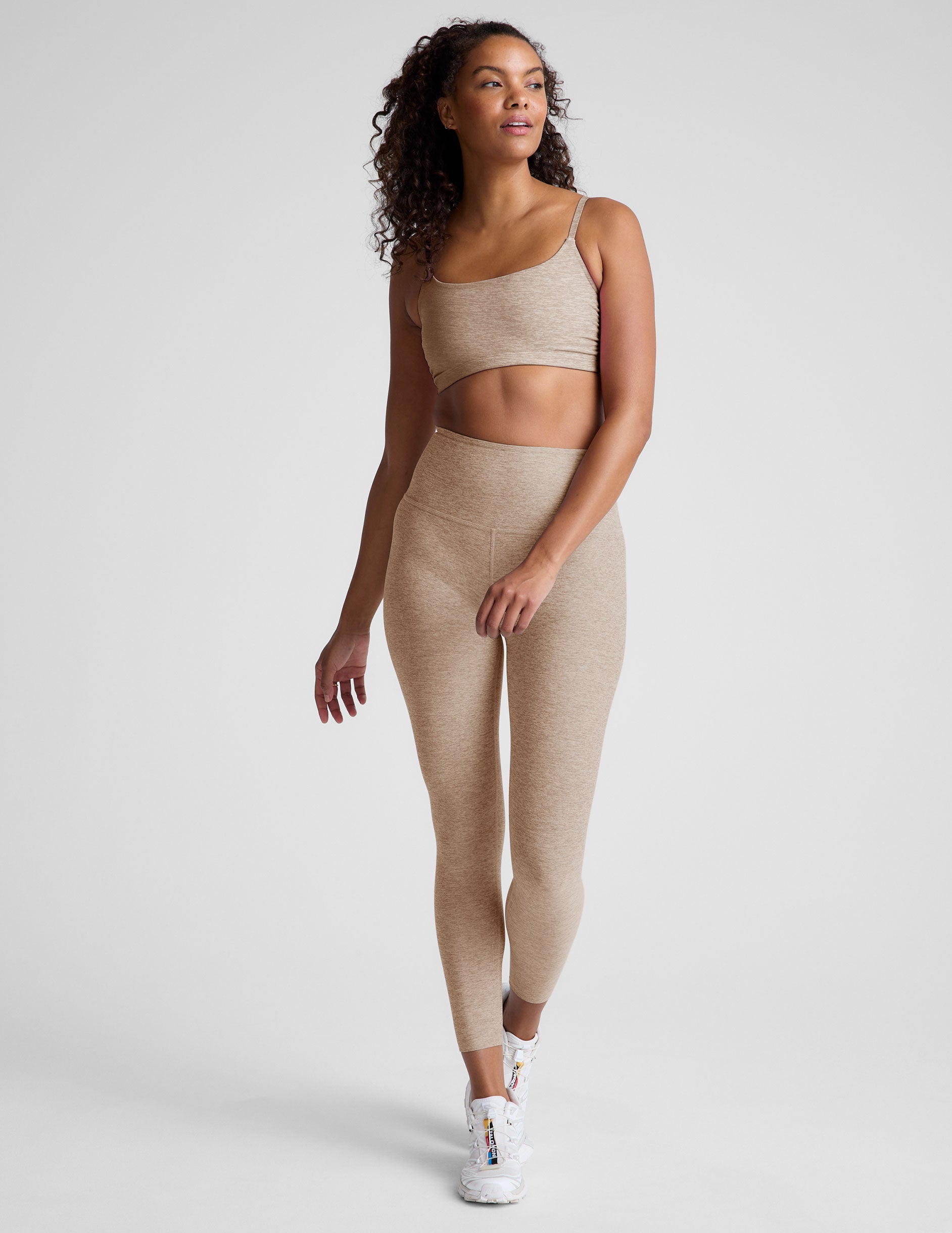 brown bra with shirred detailing on the sides and adjustable straps.