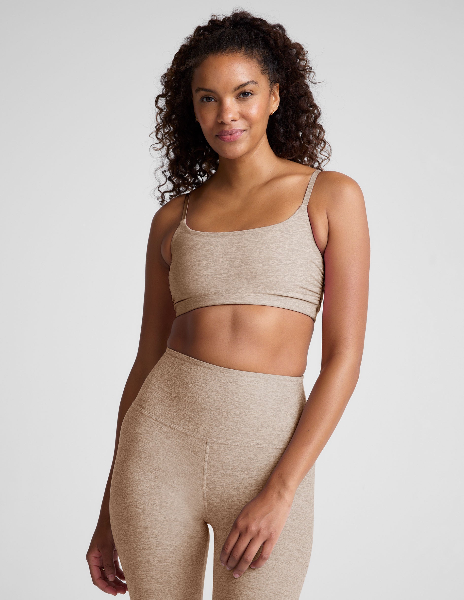 brown bra with shirred detailing on the sides and adjustable straps.