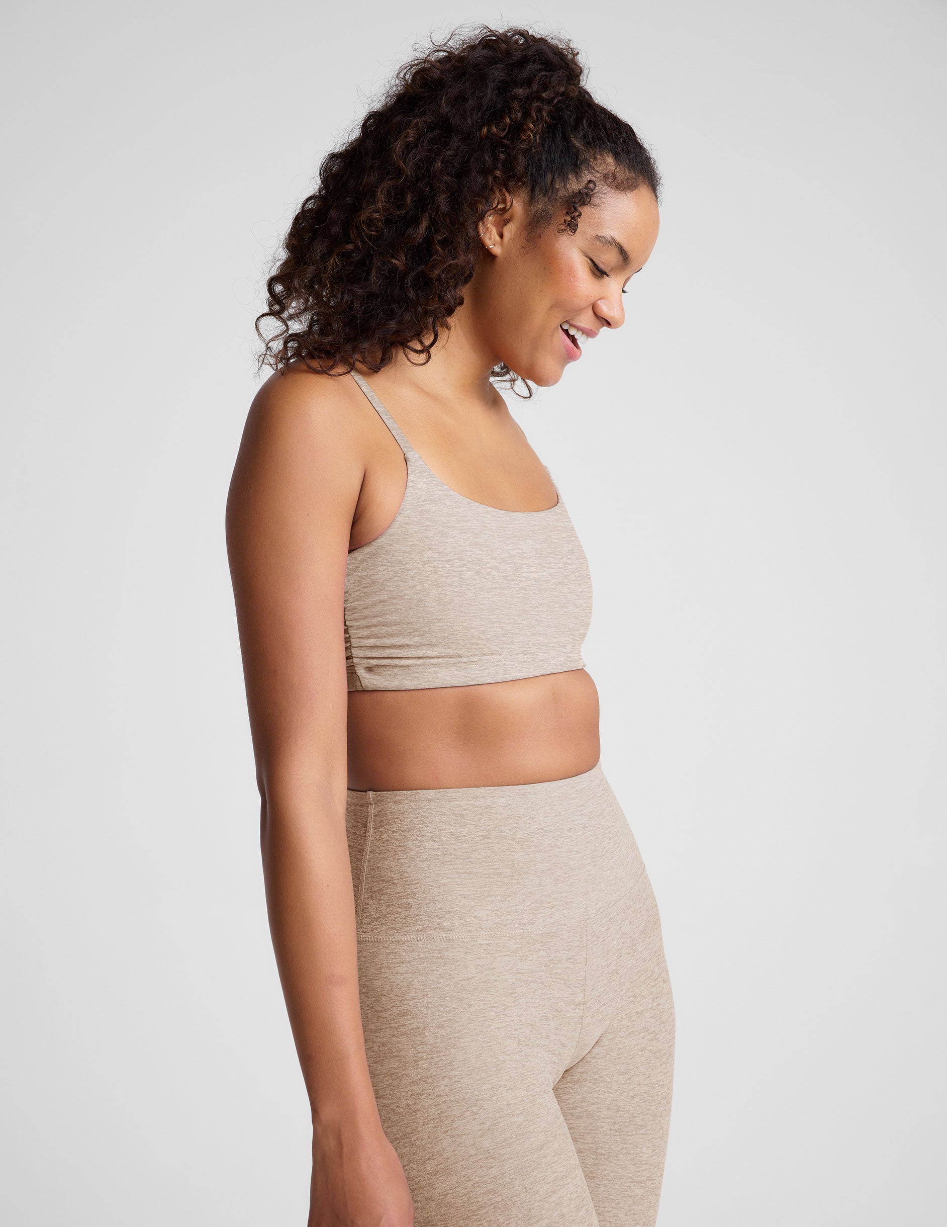 brown bra with shirred detailing on the sides and adjustable straps.