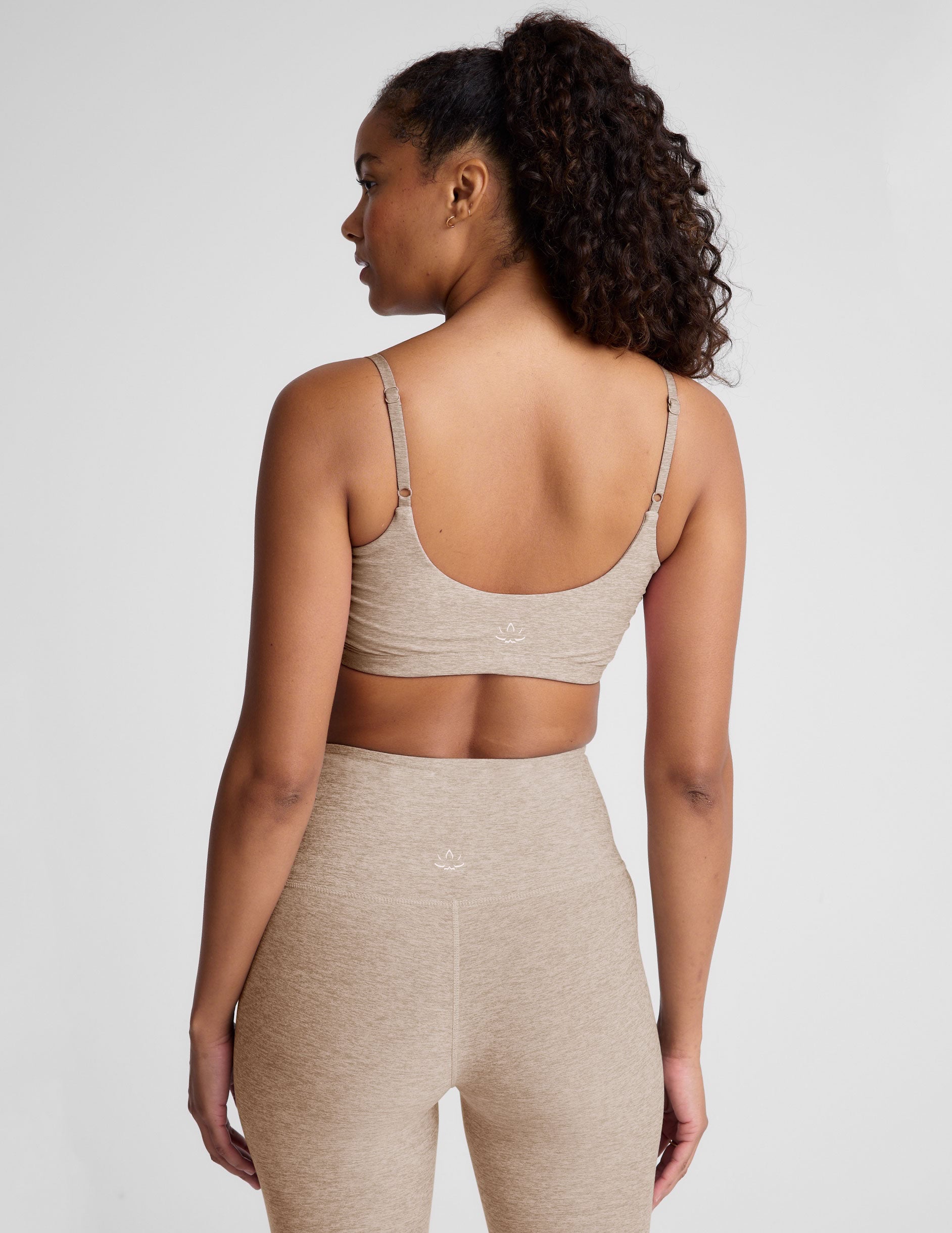 brown bra with shirred detailing on the sides and adjustable straps.