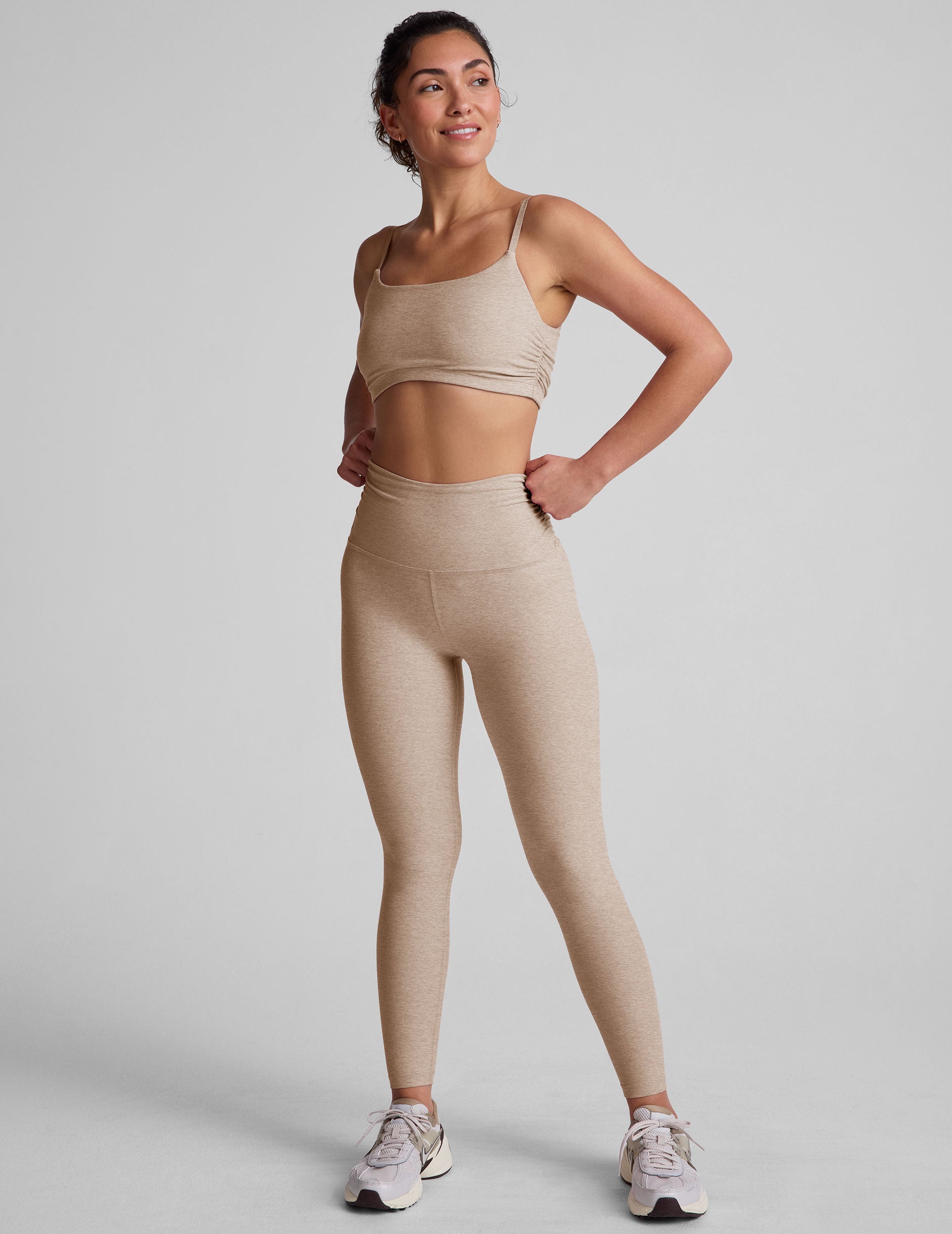 brown bra with shirred detailing on the sides and adjustable straps.