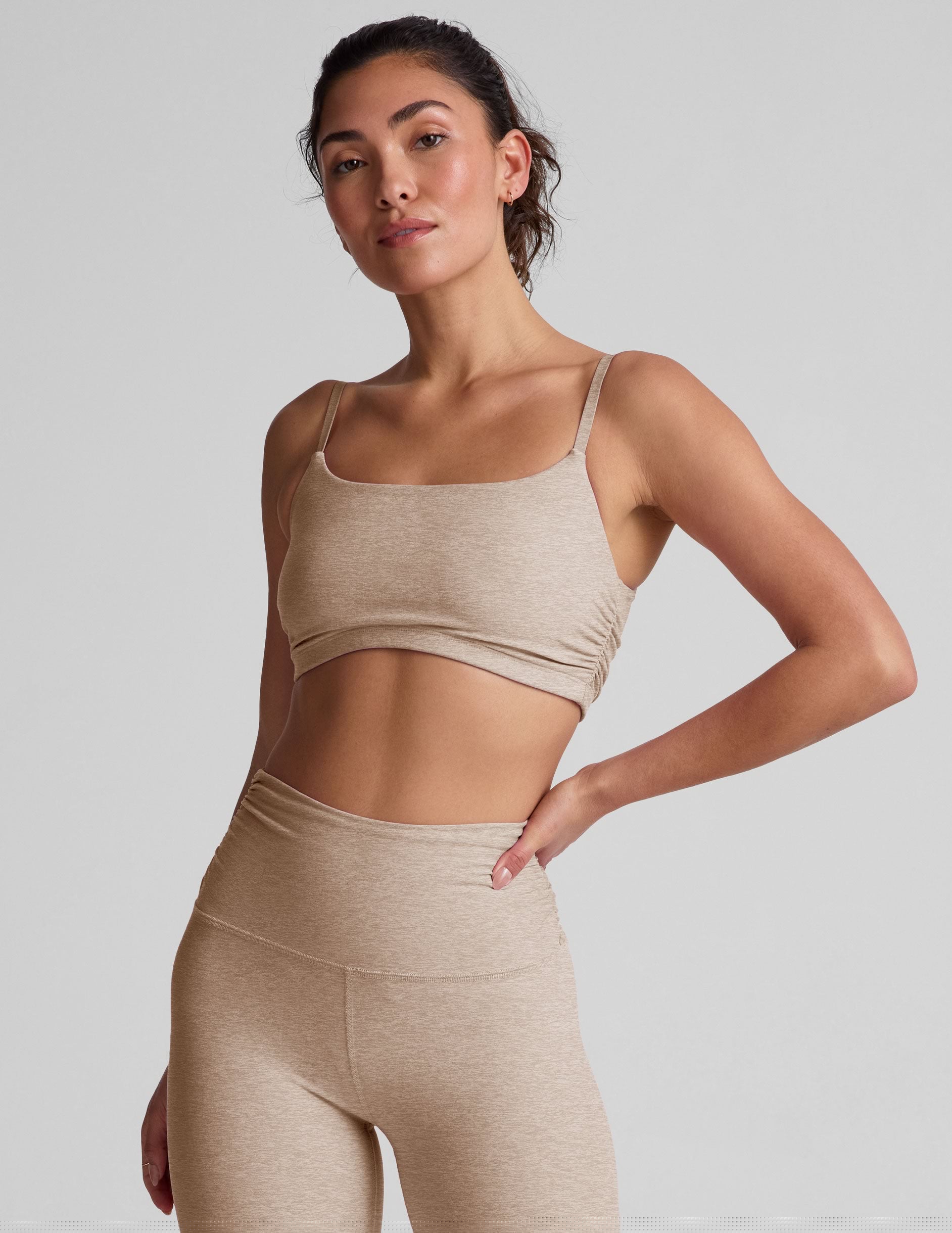 brown bra with shirred detailing on the sides and adjustable straps.