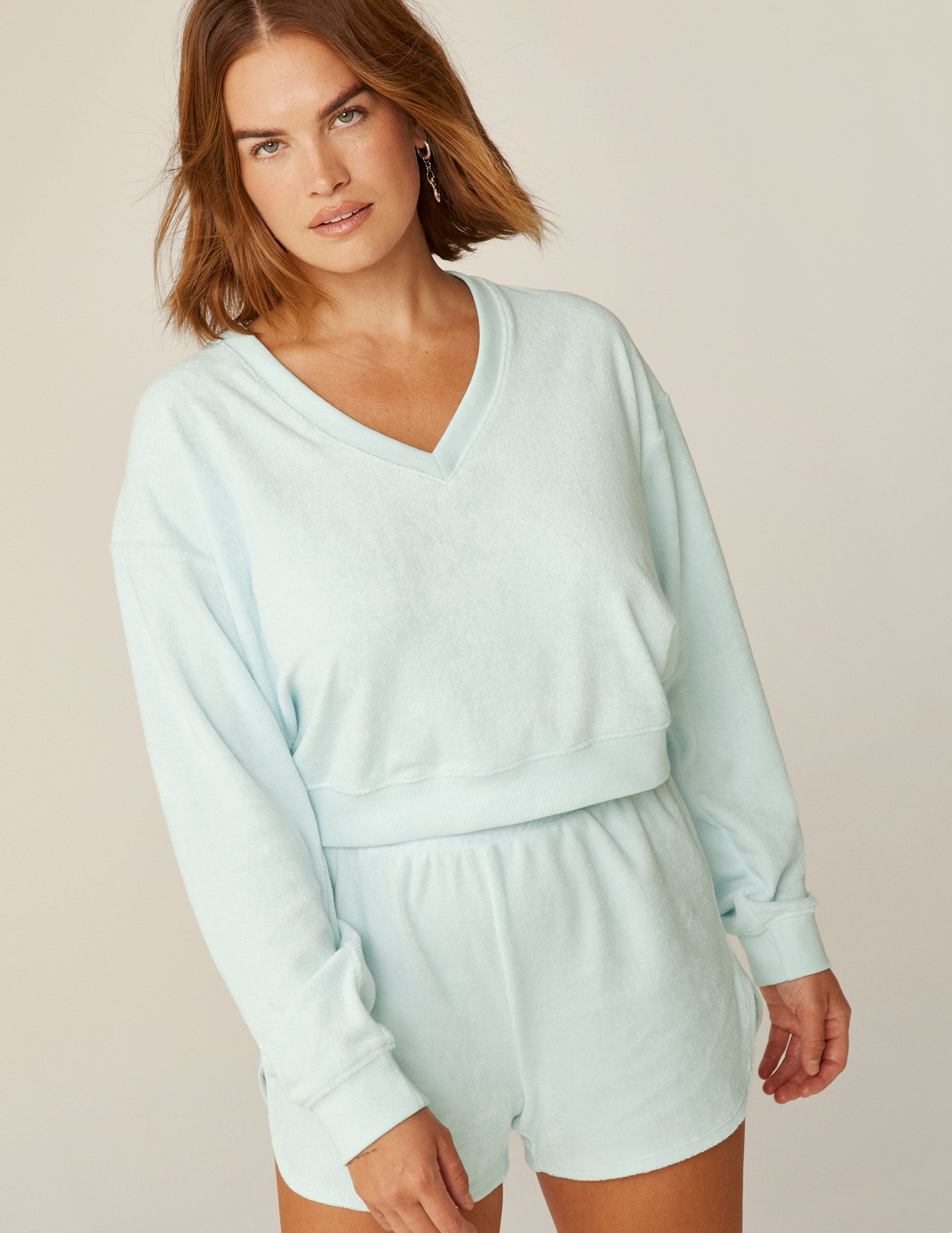 blue v-neck terry fabric long sleeve pullover.