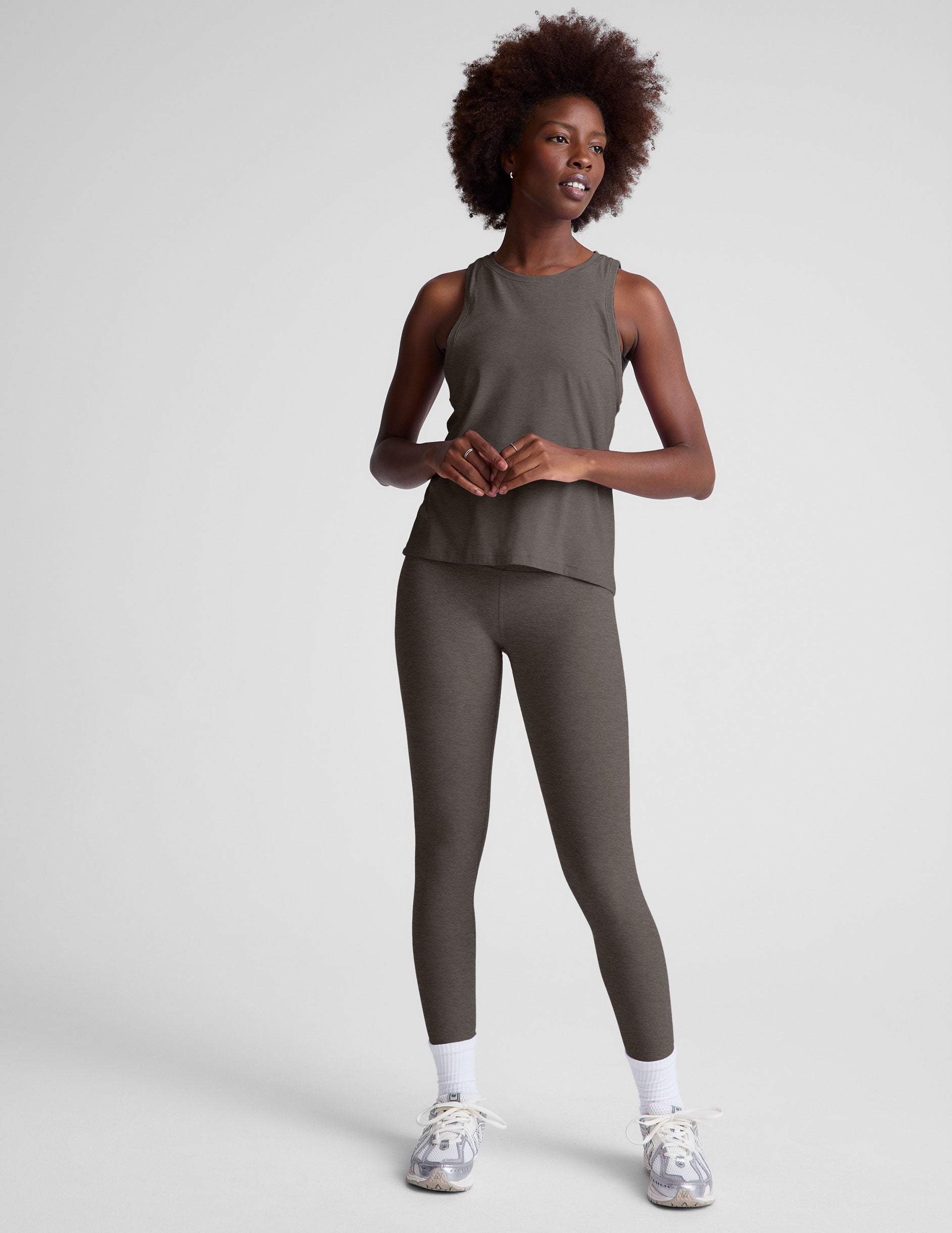 gray loose-fitting lightweight tank top with a high front neckline. 