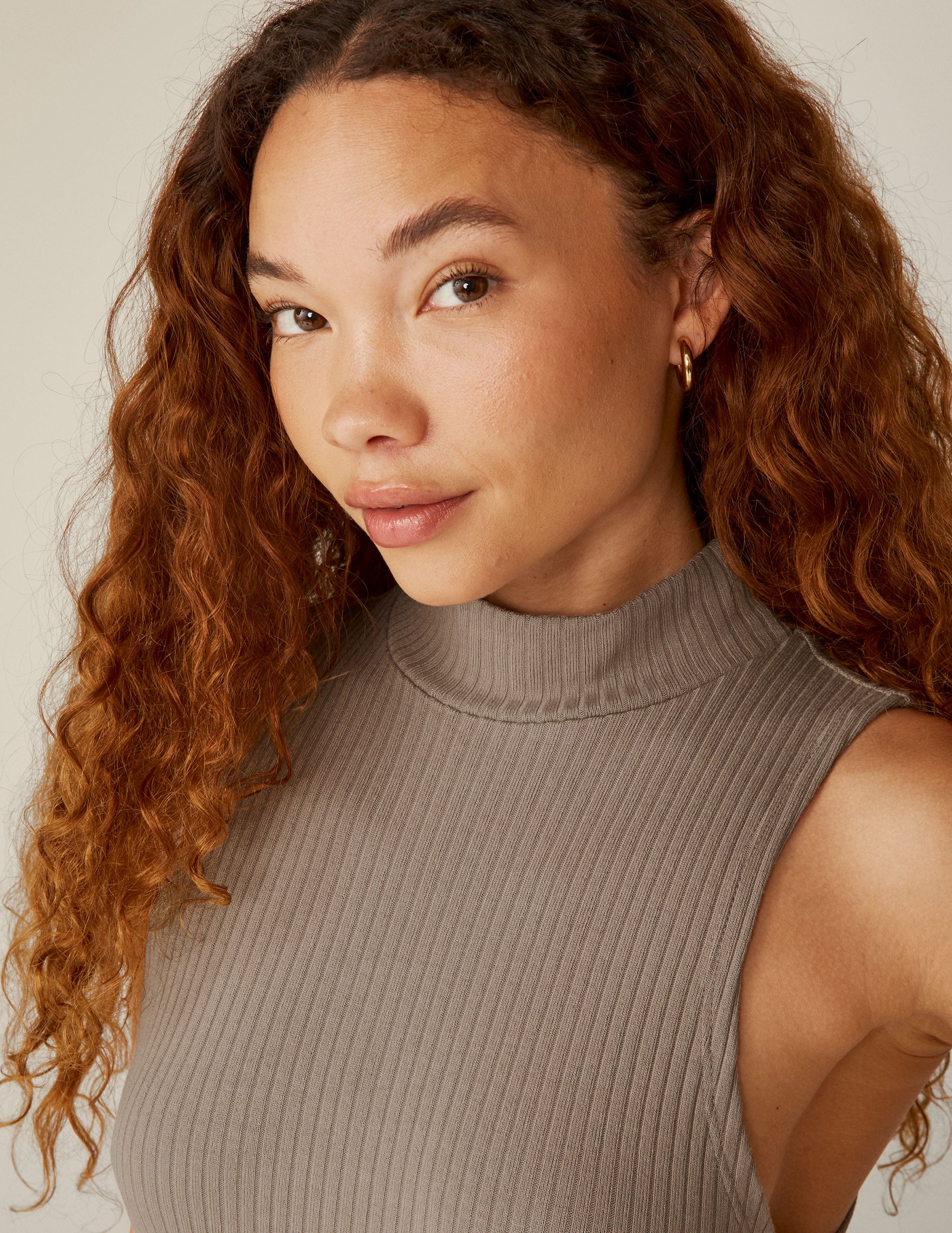 brown mock neck ribbed midi dress with a front side slit. 
