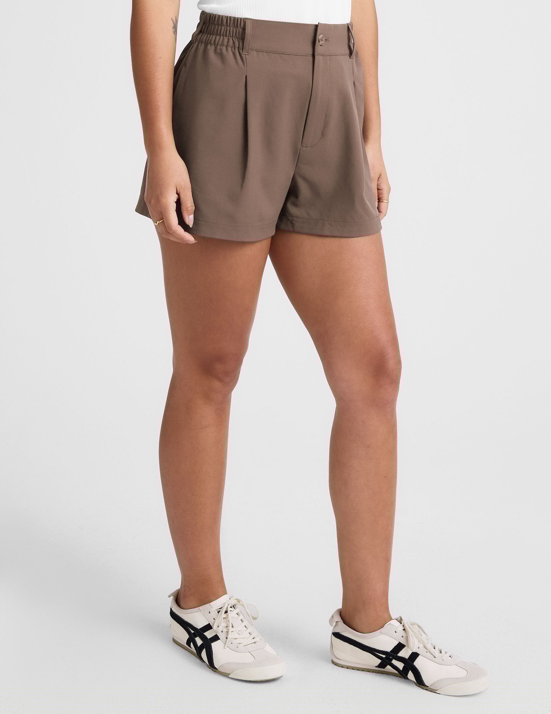 brown shorts with front pleats and side pockets. 