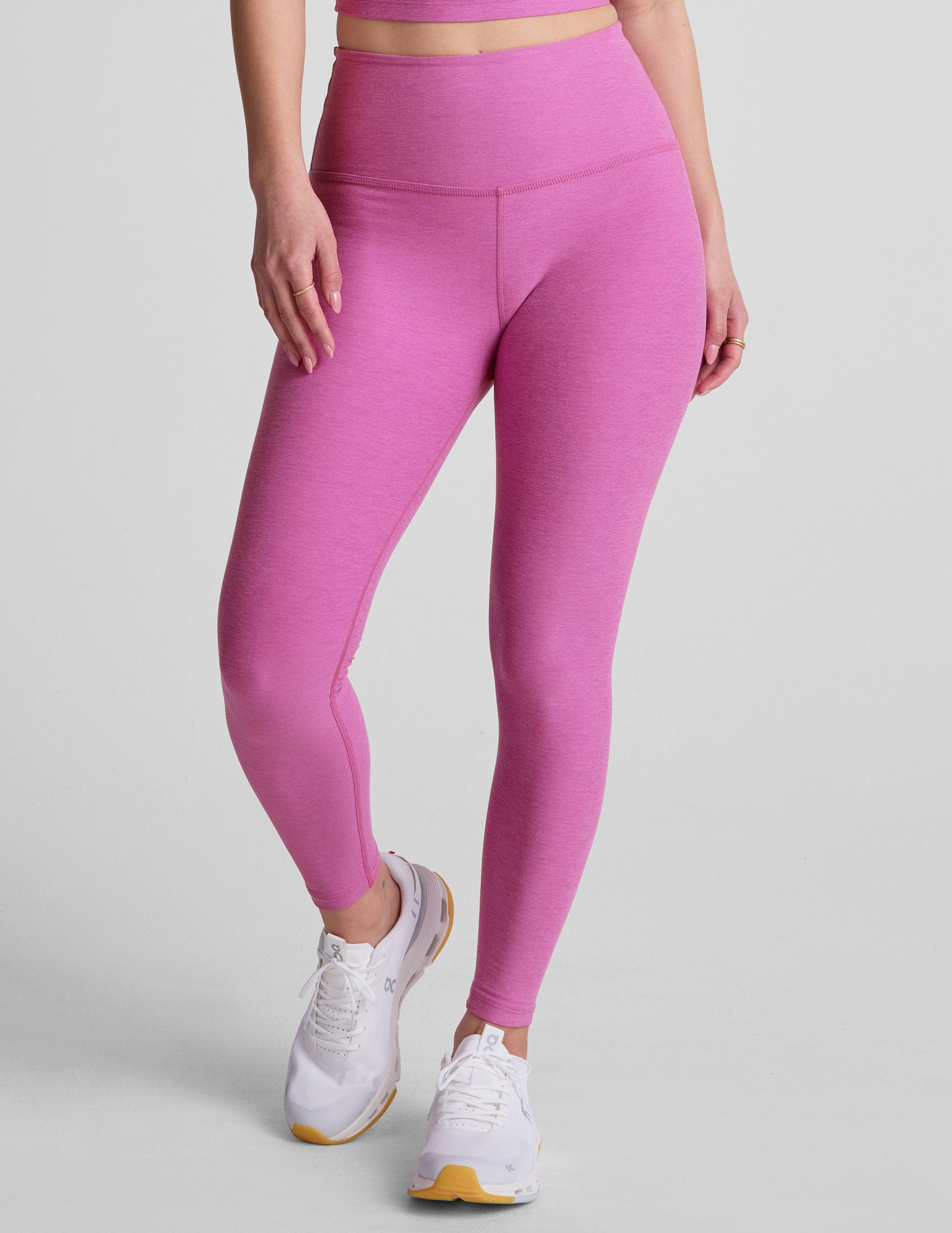 pink high-waisted midi length leggings. 