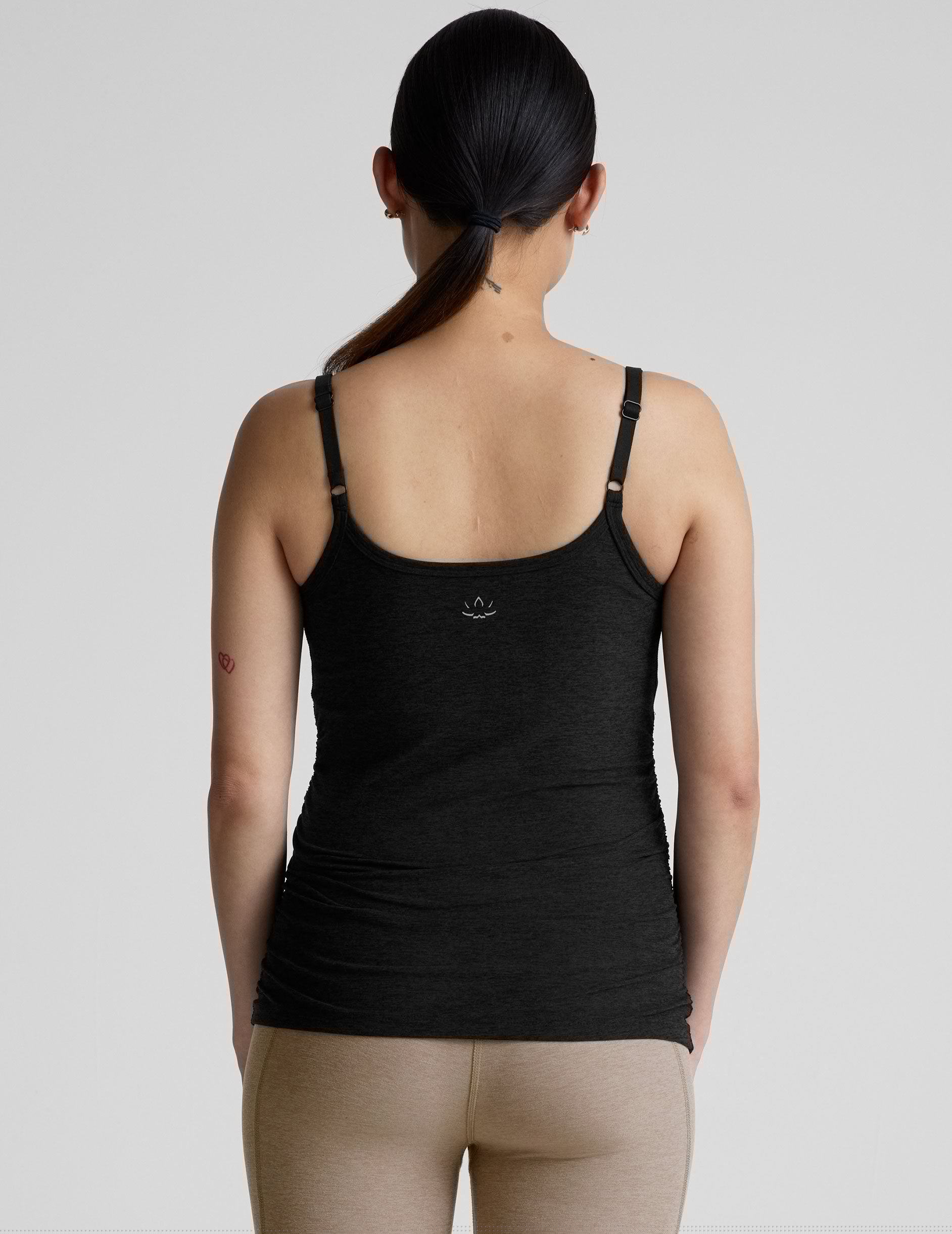 black nursing tank with adjustable straps. 