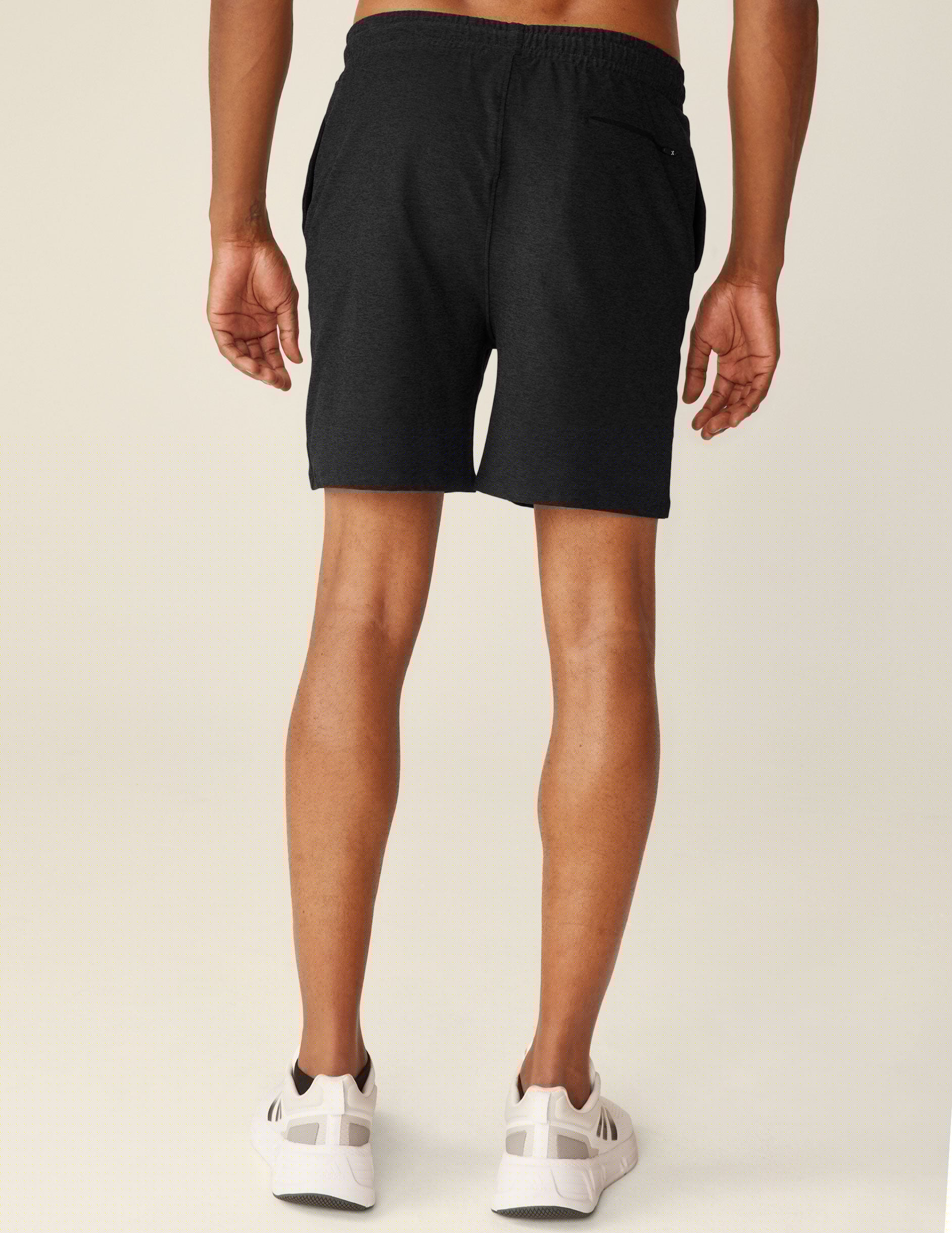 black relaxed fit men's athleisure shorts with pockets.